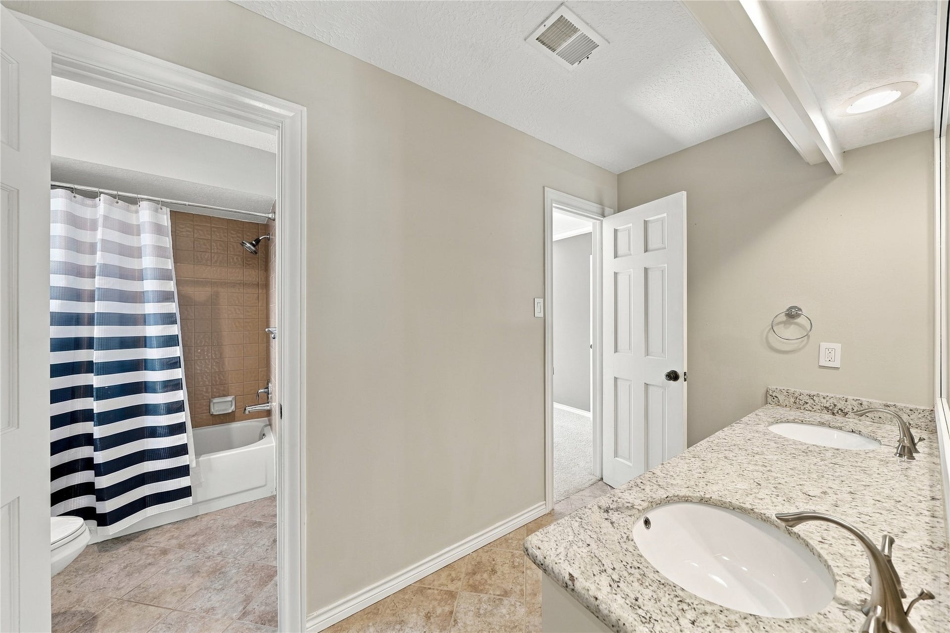 Two upstairs shared baths, double sinks