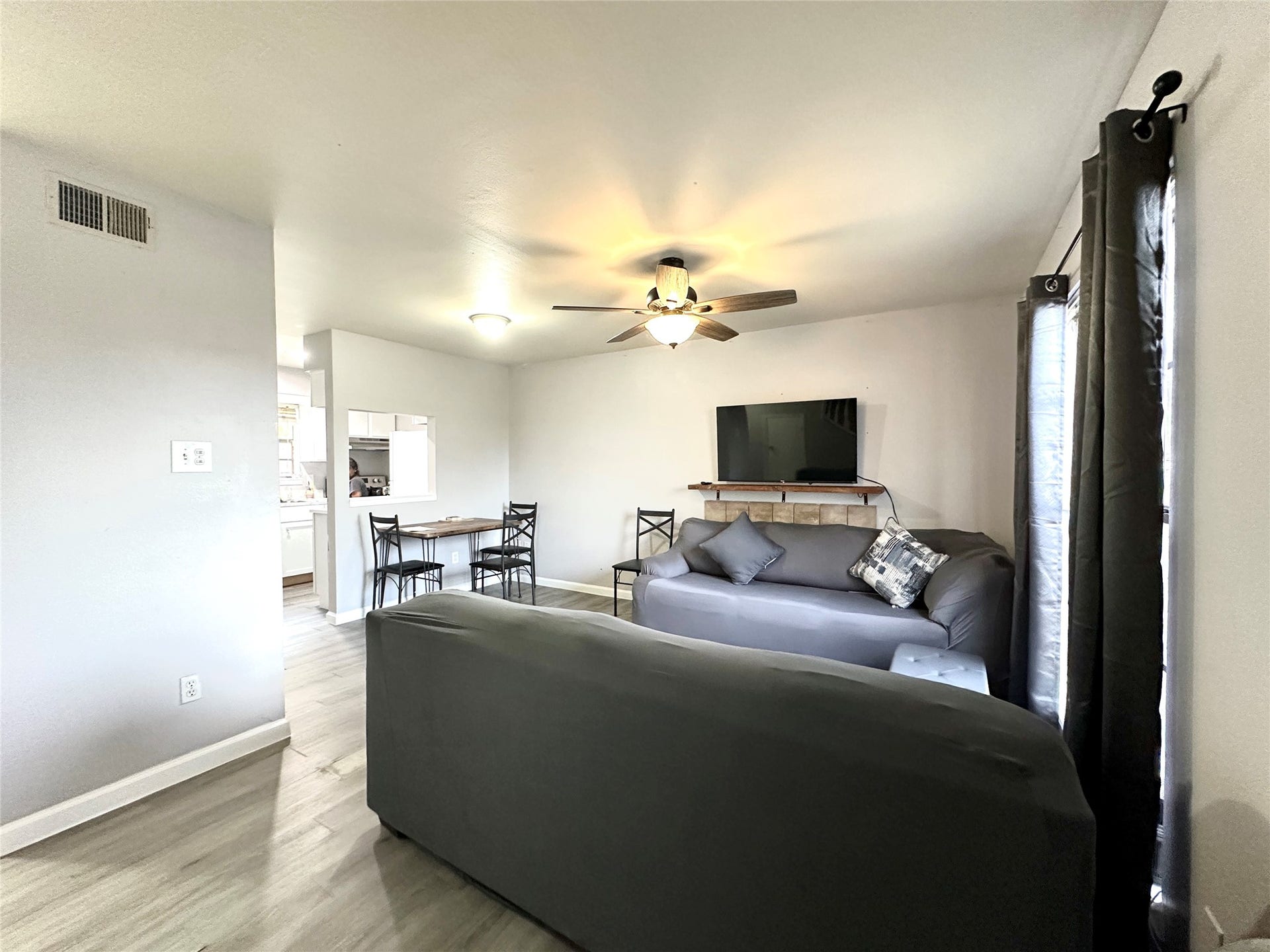4114 Hartt Lane, Houston, TX 77025 Living room with dining area and pass through opening to kitchen.