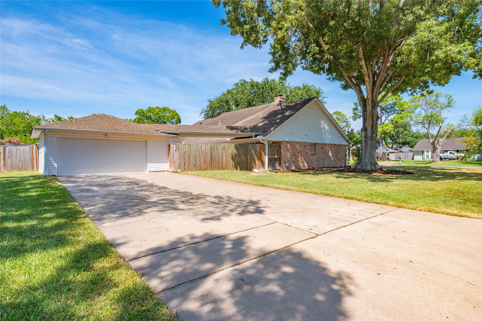 501 Audubon Street, League City, TX 77573 Double wide driveway leads to the 2 car detached garage. Ample parking on the large driveway.