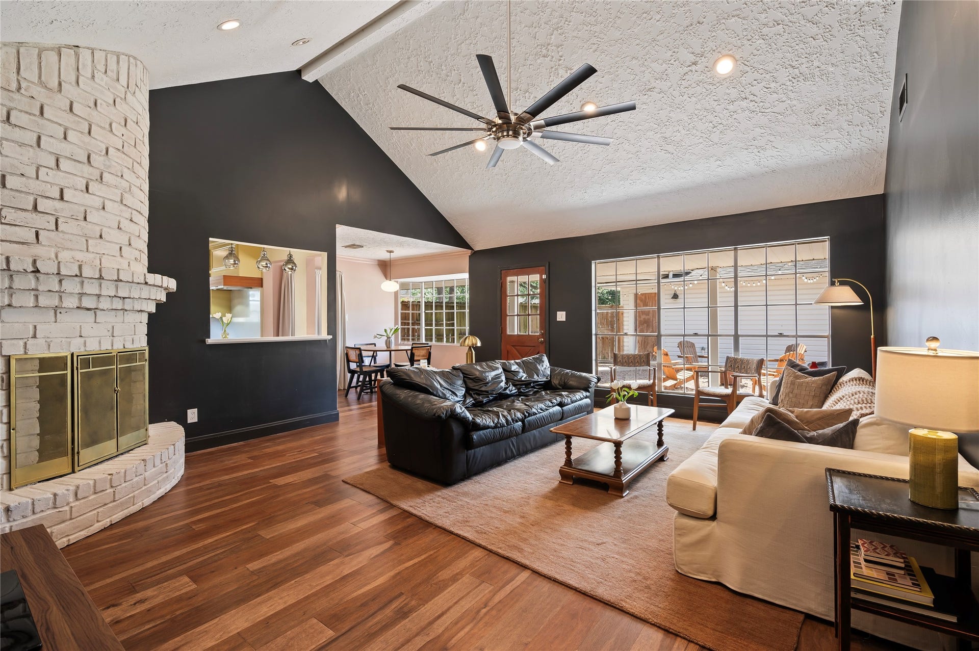 501 Audubon Street, League City, TX 77573 Very spacious living room with high ceilings, oversized stainless ceiling fan and brick fireplace.