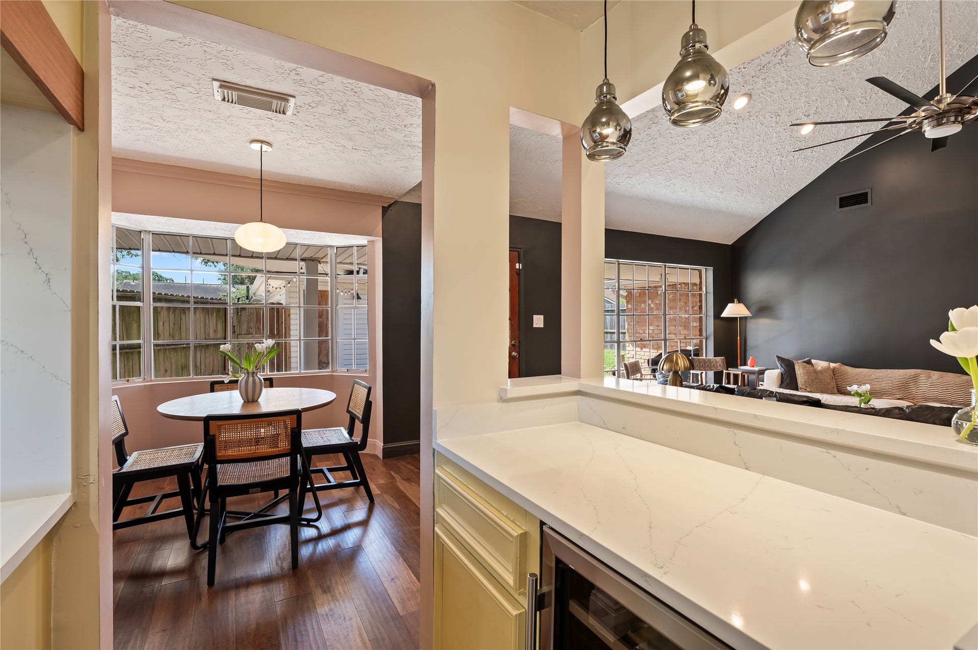 501 Audubon Street, League City, TX 77573 Bar area with custom light fixtures leads to the breakfast area.