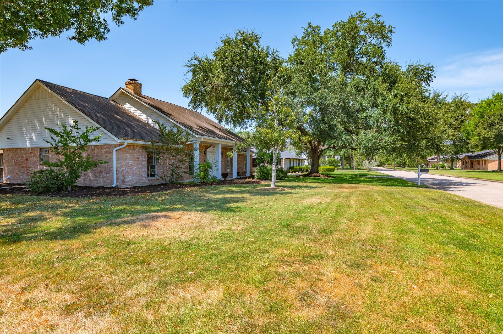501 Audubon Street, League City, TX 77573 Another view of the large front yard of the corner lot property.