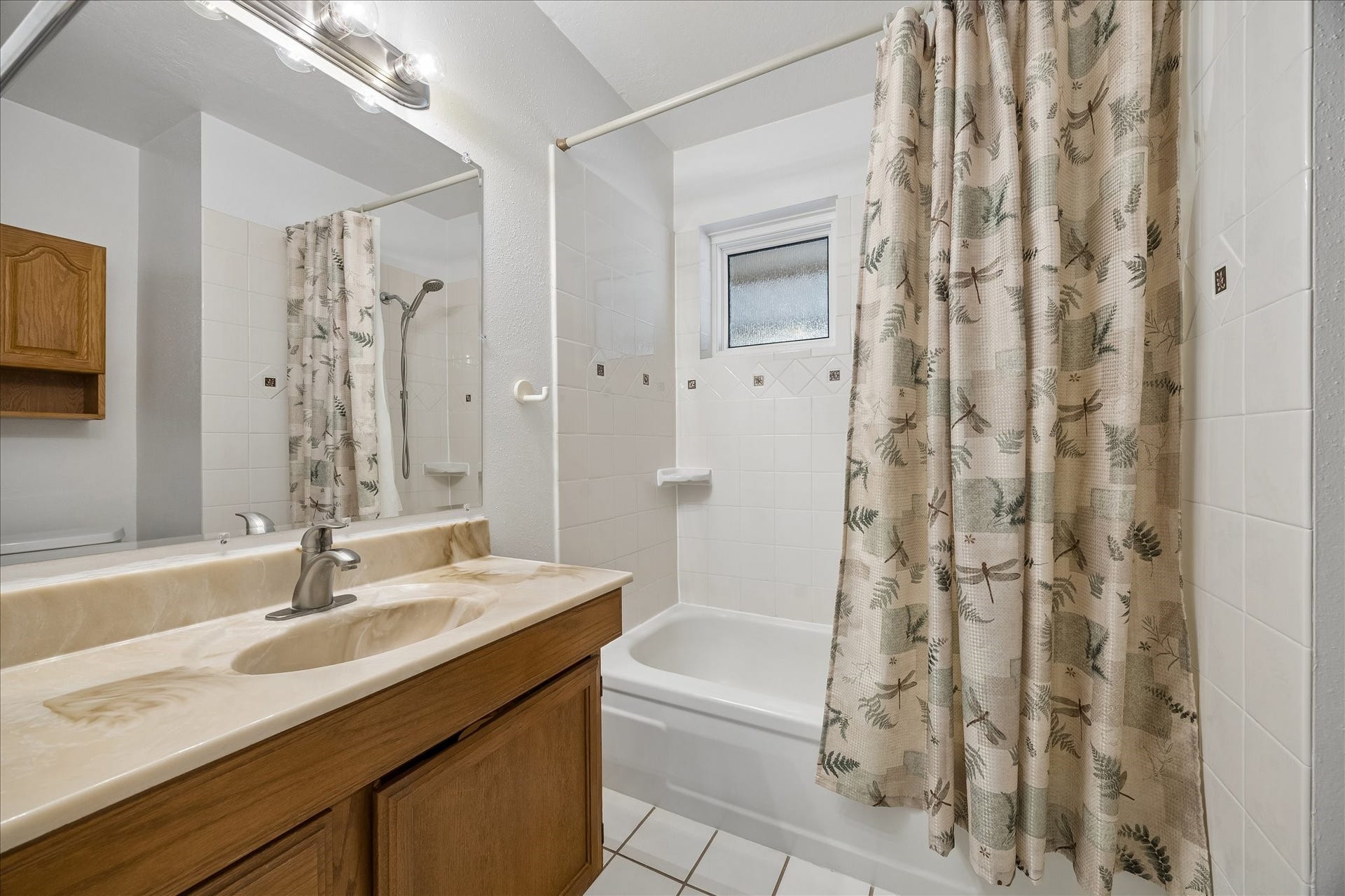 13626 Greenridge Drive, Sugar Land, TX 77498 Bathroom featuring a clean tub-shower combo