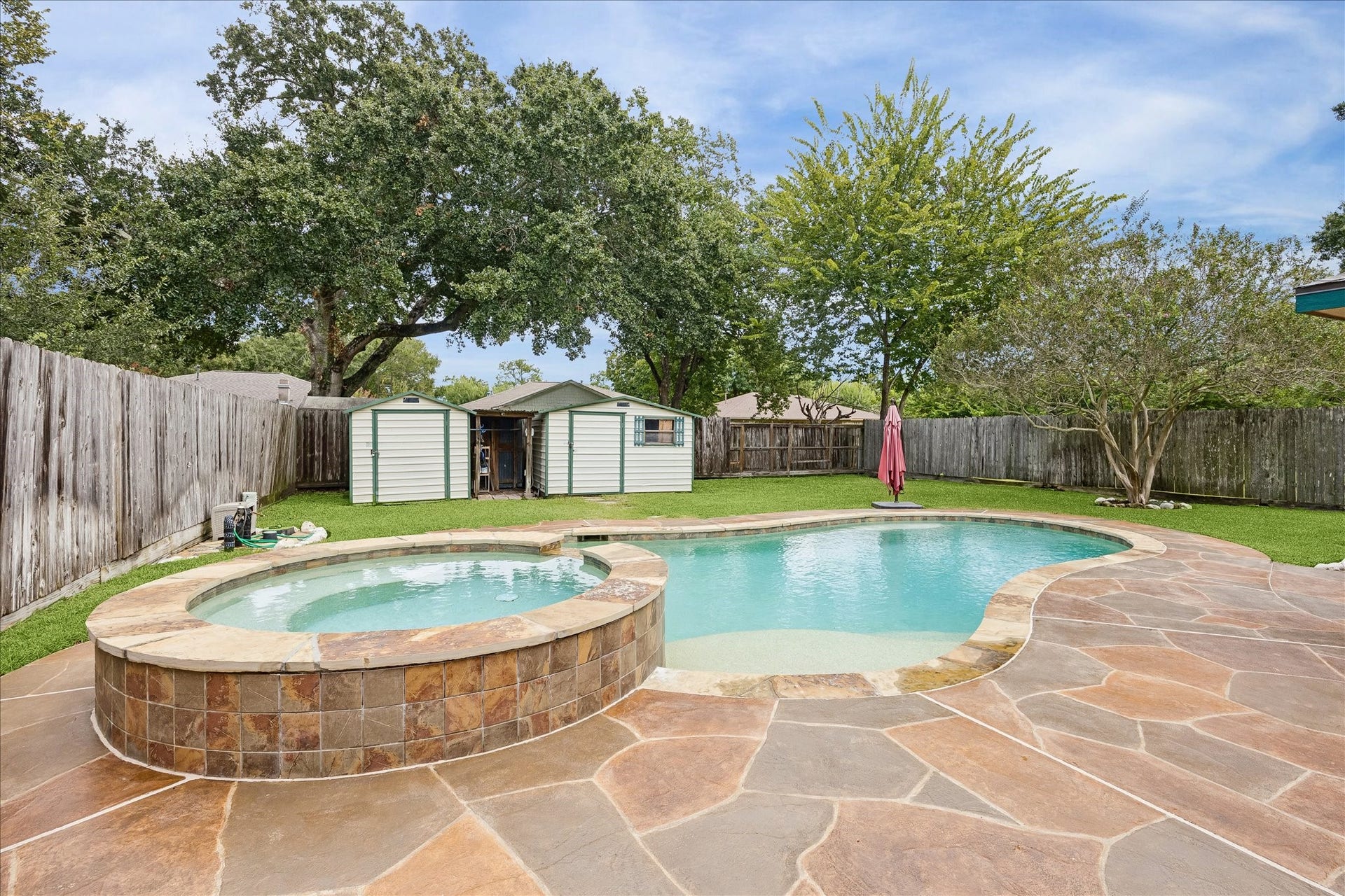 13626 Greenridge Drive, Sugar Land, TX 77498 Discover your private oasis with a sparkling pool, relaxing hot tub and spacious patio.