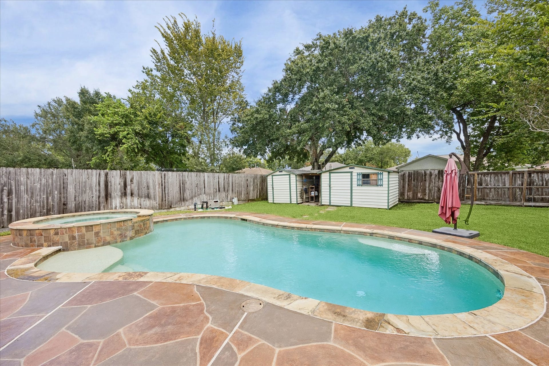 13626 Greenridge Drive, Sugar Land, TX 77498 Discover your private oasis with a sparkling pool, relaxing hot tub and spacious patio.