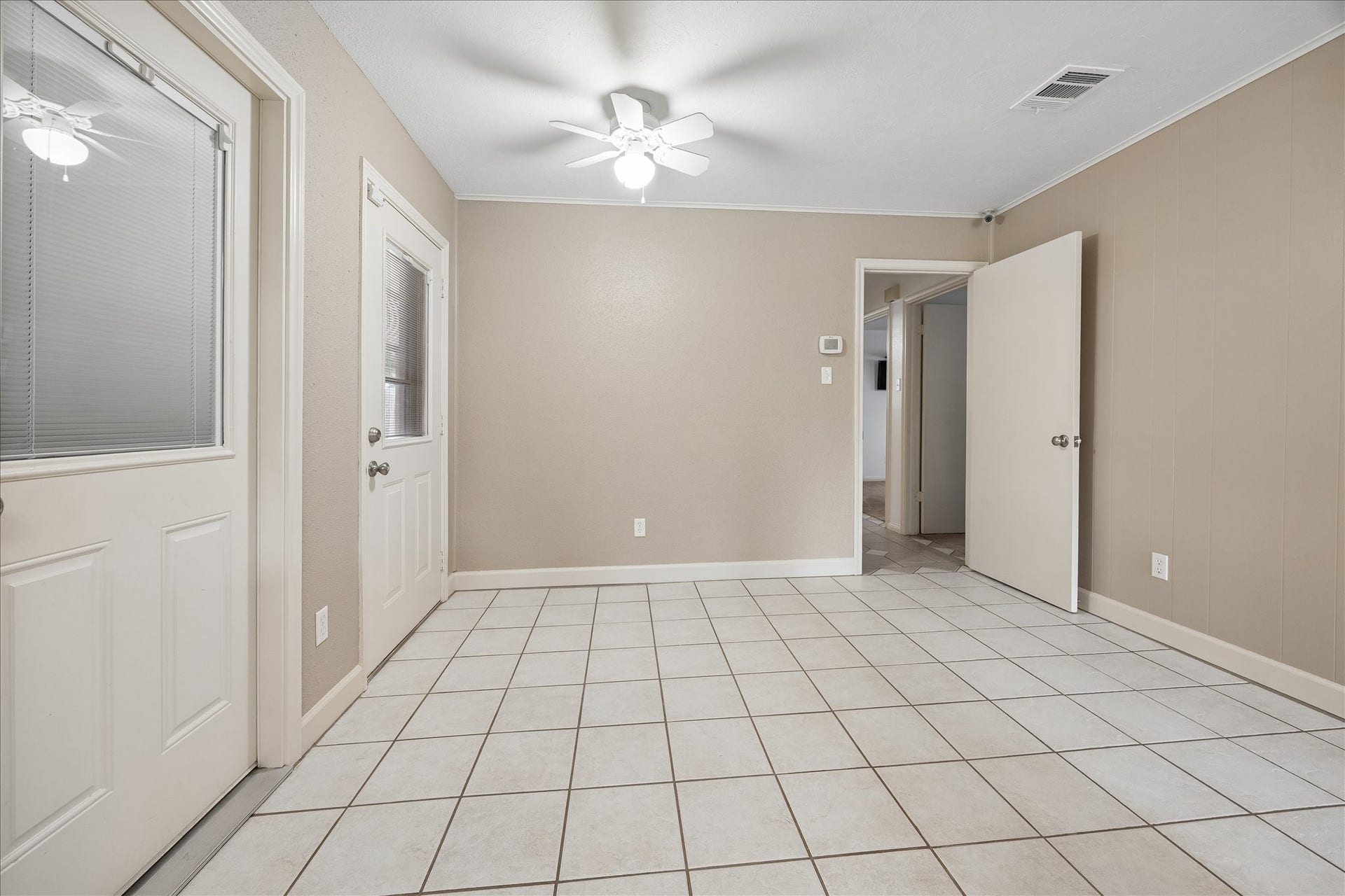 13626 Greenridge Drive, Sugar Land, TX 77498 Dining area with doors leading to the back patio and garage