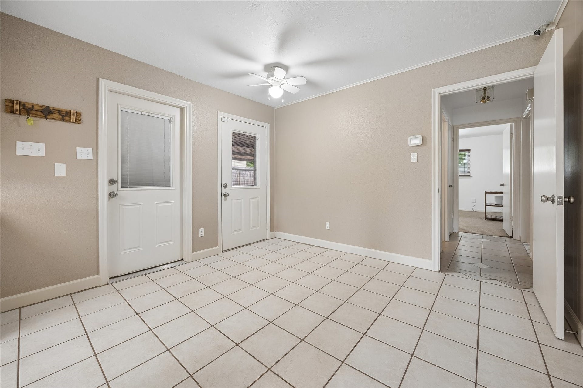 13626 Greenridge Drive, Sugar Land, TX 77498 Dining area with doors leading to the back patio and garage