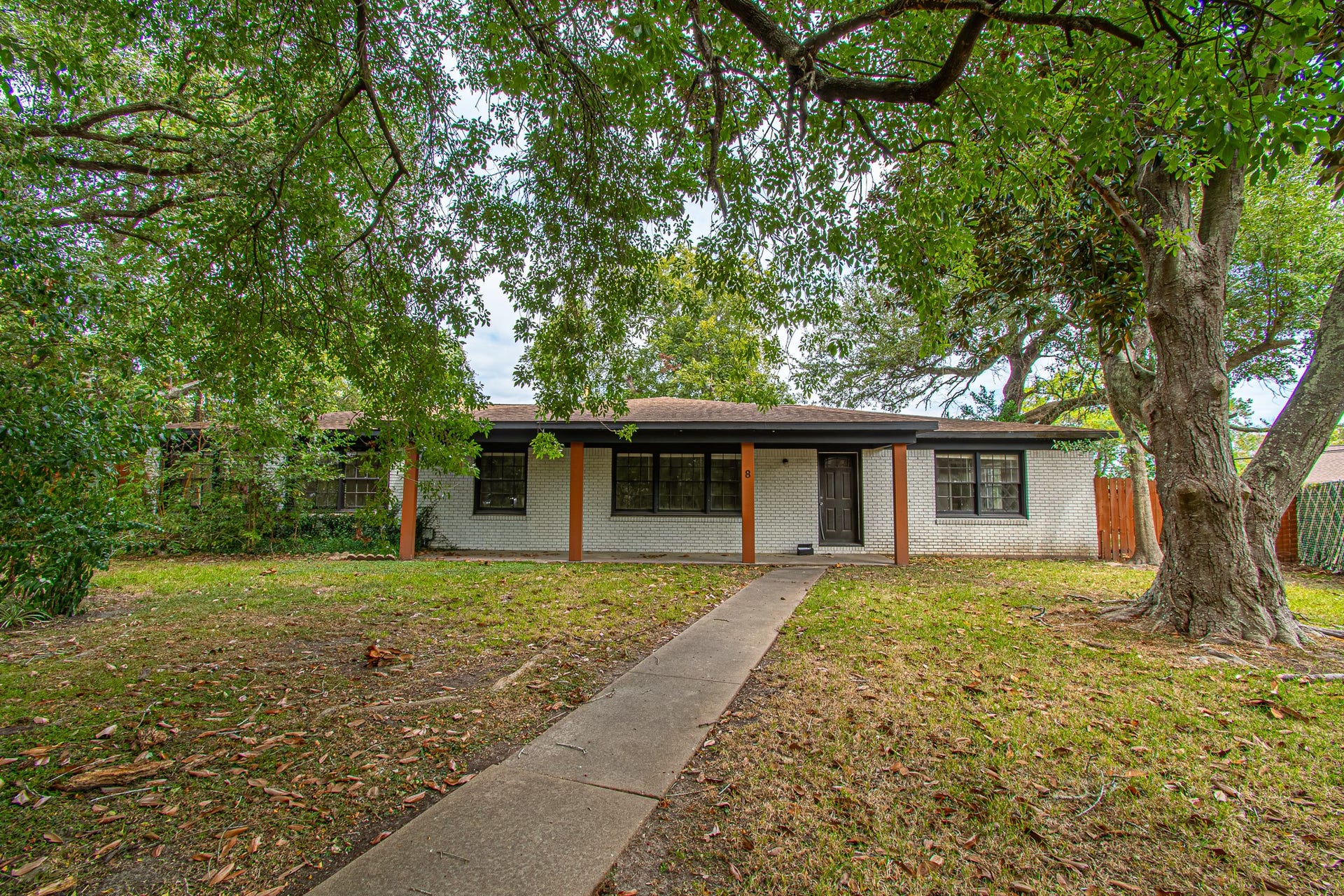8 Coronado Circle, La Marque, TX 77568 The Cul-De-Sac pathway to this house is surrounding by charming trees.