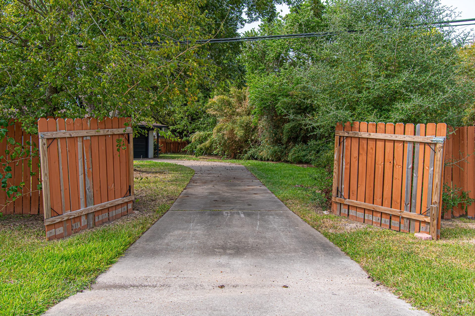 8 Coronado Circle, La Marque, TX 77568 Driveway Gate to the back entrance, driveway, and garage.