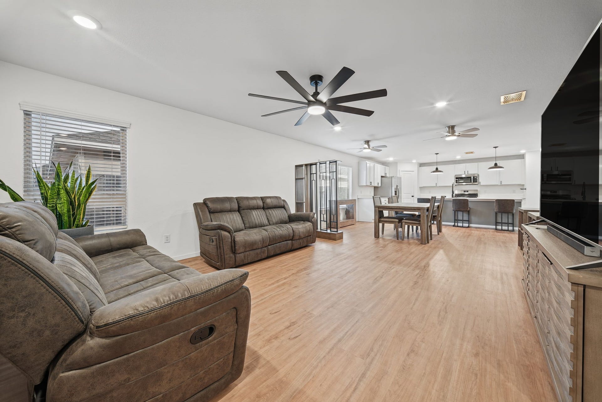 13778 Kit Run, Splendora, TX 77372 Step inside to a SPACIOUS OPEN-CONCEPT family room, dining area and kitchen, creating the perfect space for everyday living and entertaining!