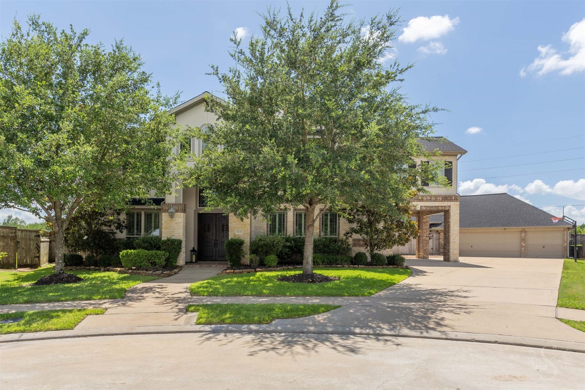 5835 Caspian Falls Lane, Fulshear, TX 77441 Exceptional luxury home on a huge cul-de-sac lot in Cross Creek Ranch featuring 5 bedrooms (2 down), 4 full baths, 2 half baths and a porte cochere that leads to the detached 6-car garage. Step outside to your private backyard paradise where the oversized lot showcases a spectacular custom Omega pool with spa, waterfall and slide.