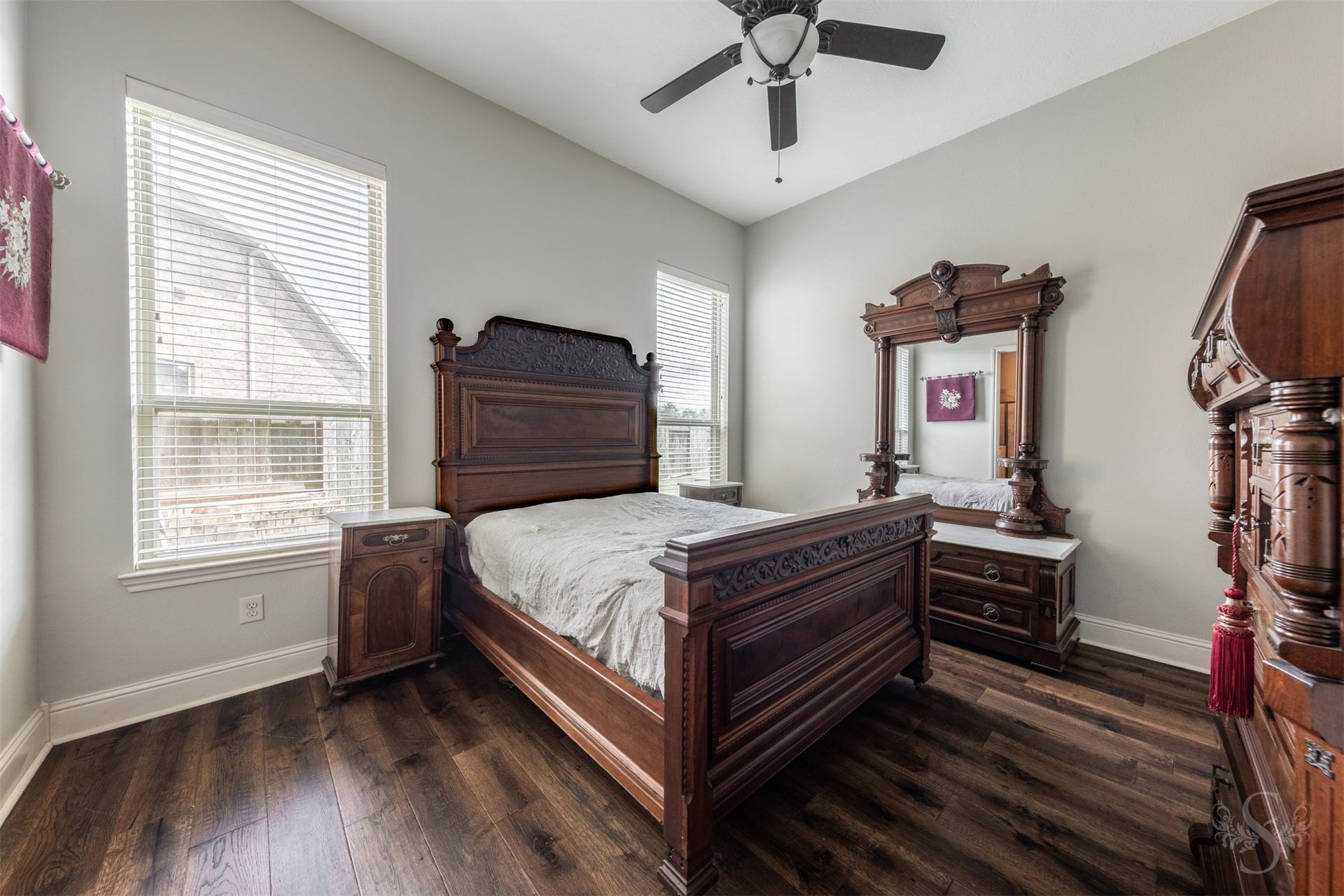 5835 Caspian Falls Lane, Fulshear, TX 77441 Conveniently located on the first floor, this spacious secondary bedroom is ideal for guests, multigenerational living or a private in-law suite. Wood flooring, large windows and easy access to a full bath create a comfortable and inviting retreat.