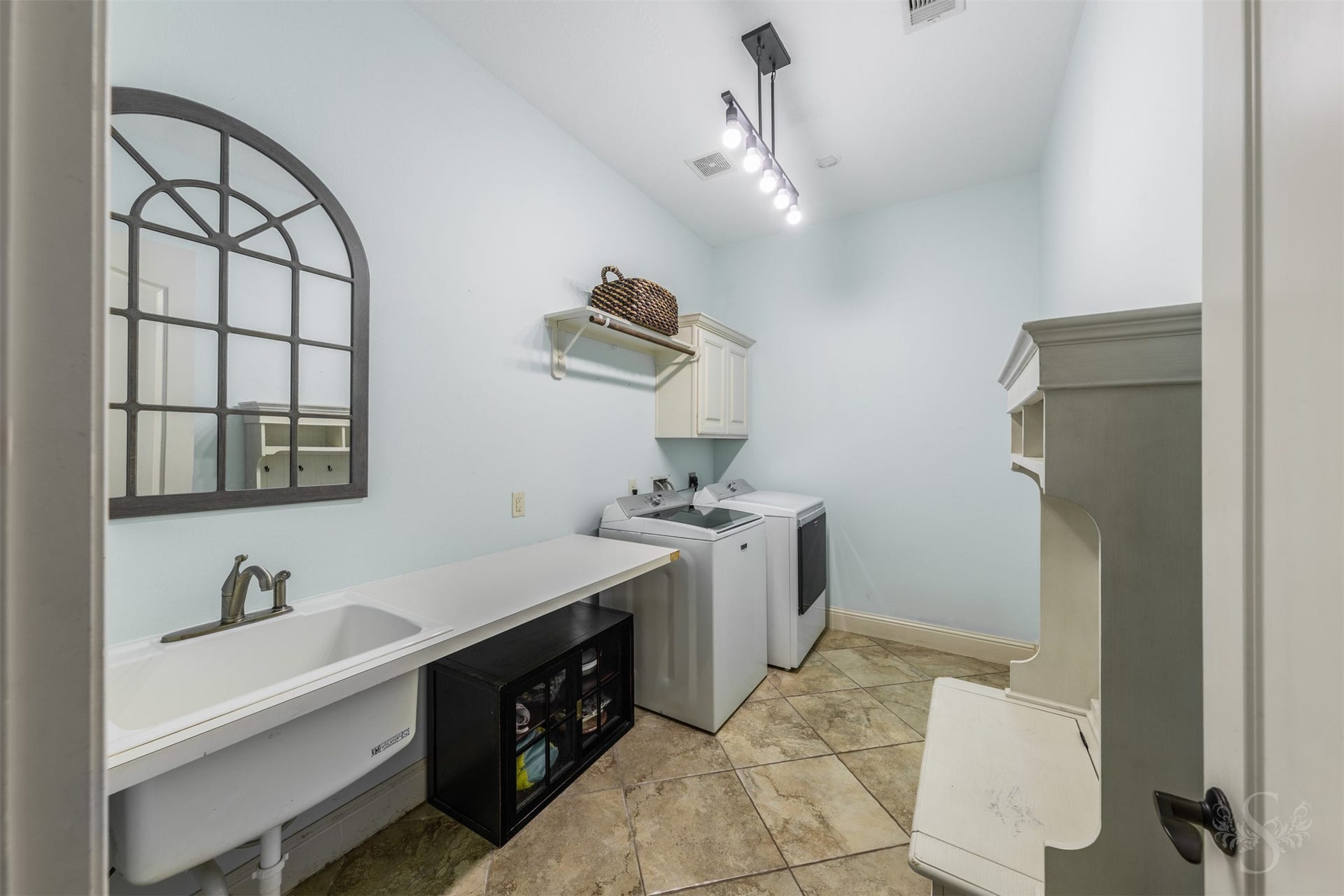 5835 Caspian Falls Lane, Fulshear, TX 77441 Designed with convenience in mind, the spacious utility room offers abundant storage, a utility sink and plenty of workspace for everyday household tasks. Thoughtful built-ins help keep everything organized and within easy reach.
