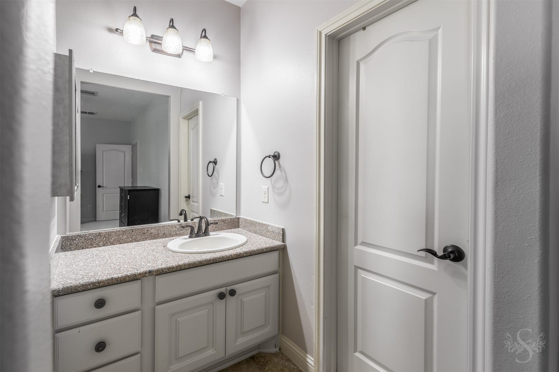 5835 Caspian Falls Lane, Fulshear, TX 77441 This separate vanity space provides additional privacy and storage while serving the adjoining secondary bedrooms. Granite countertops and neutral finishes create a clean, timeless look.