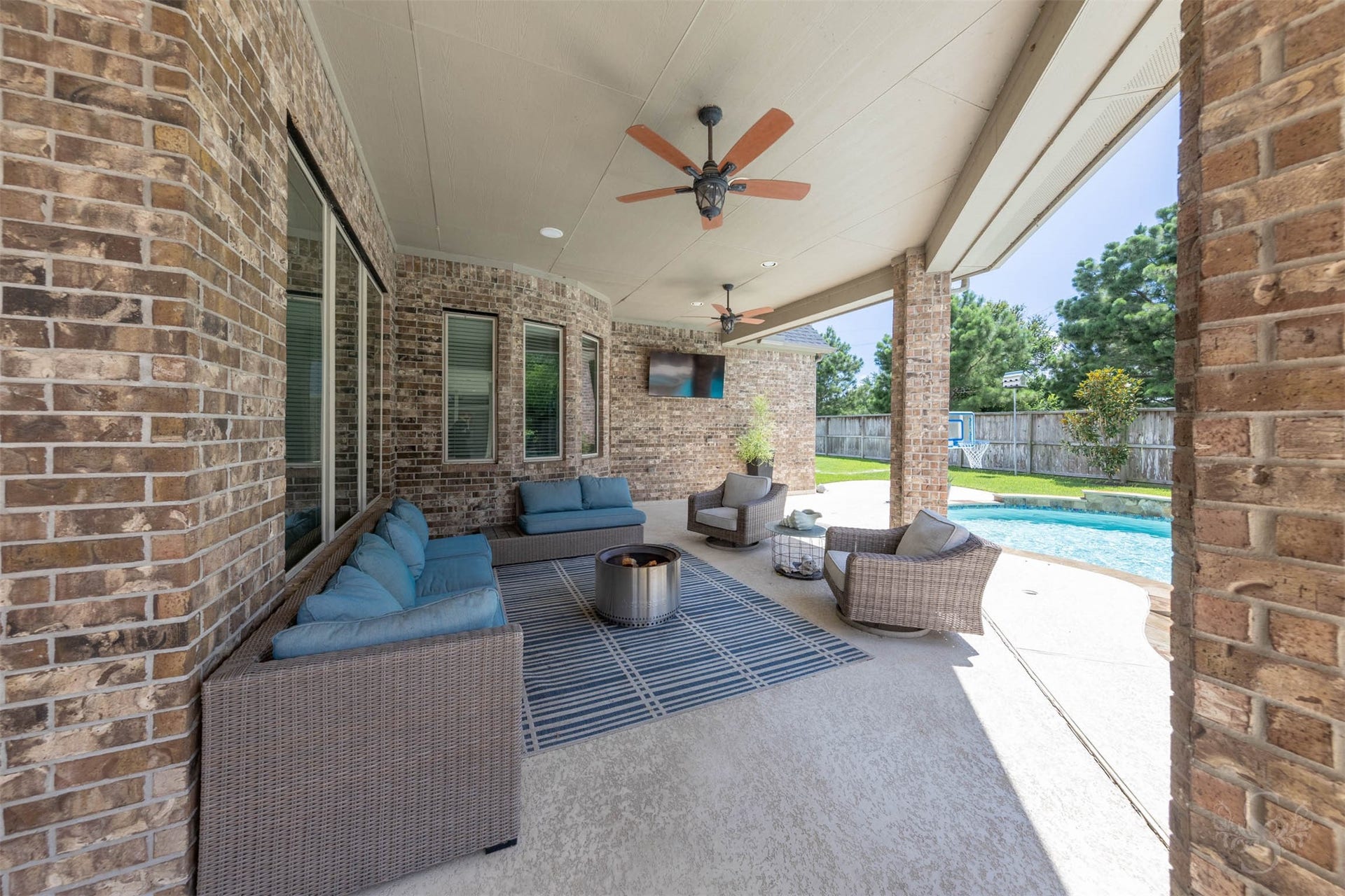 5835 Caspian Falls Lane, Fulshear, TX 77441 The expansive covered patio offers plenty of room for a large dining table as well as a separate conversation area for relaxing and entertaining. Overlooking the pool and backyard, this inviting outdoor space extends your living area and is perfect for gatherings of any size.
