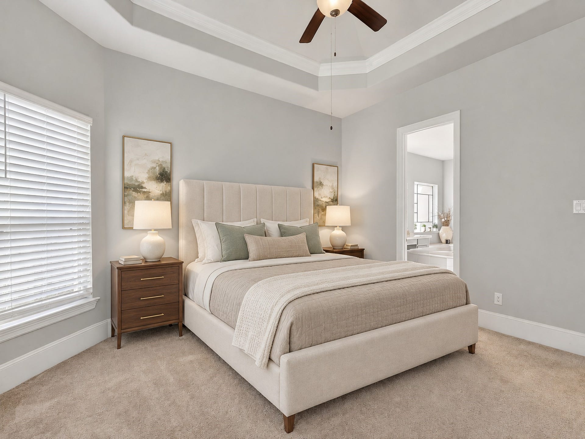 6714 Wellbrook Falls Lane, Katy, TX 77493 Primary bedroom features a tray ceiling, ceiling fan, and adjoining bath access. (virtually staged)
