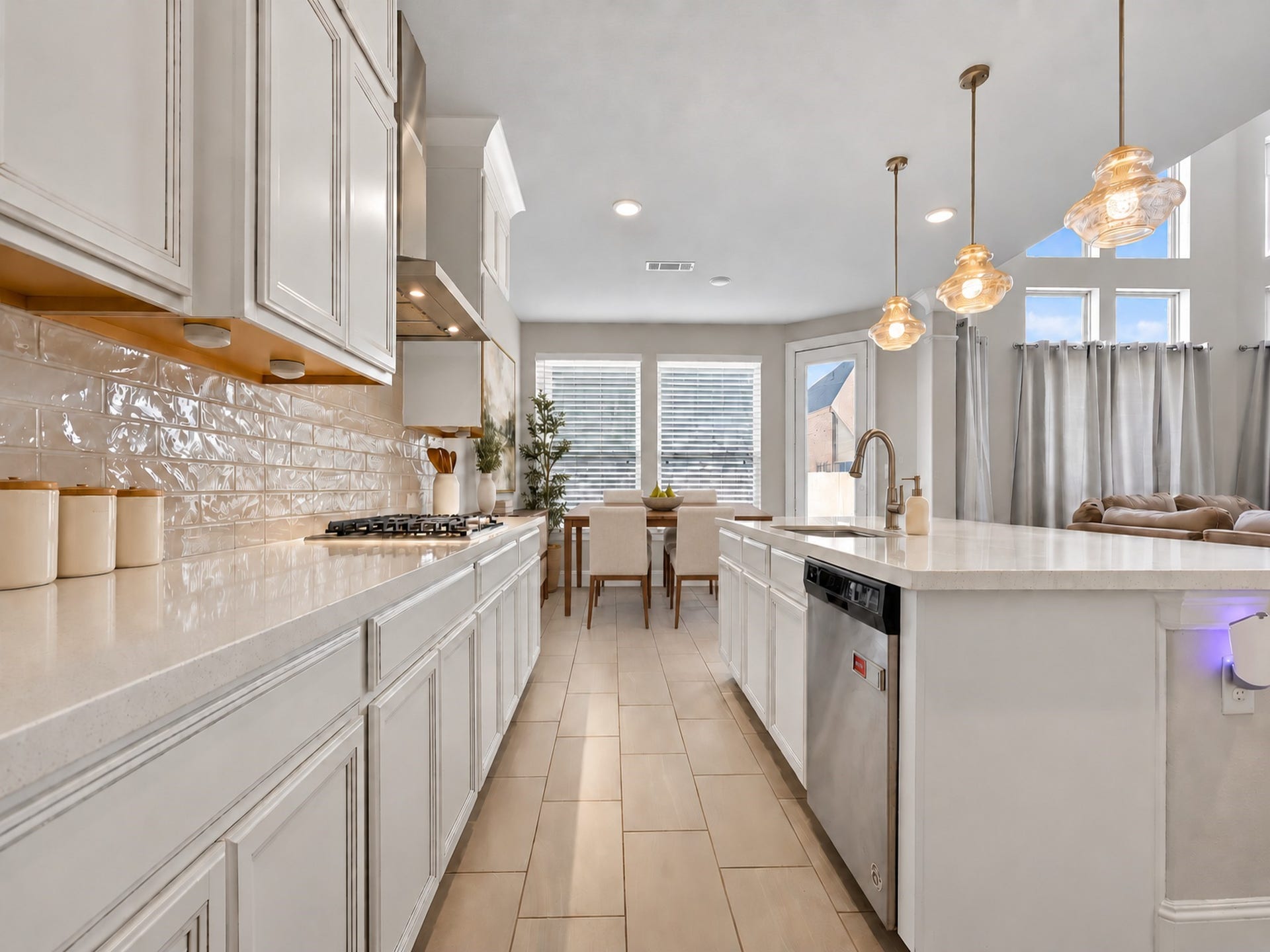 6714 Wellbrook Falls Lane, Katy, TX 77493 Kitchen opens toward the breakfast area and living room for easy flow. (virtually staged)