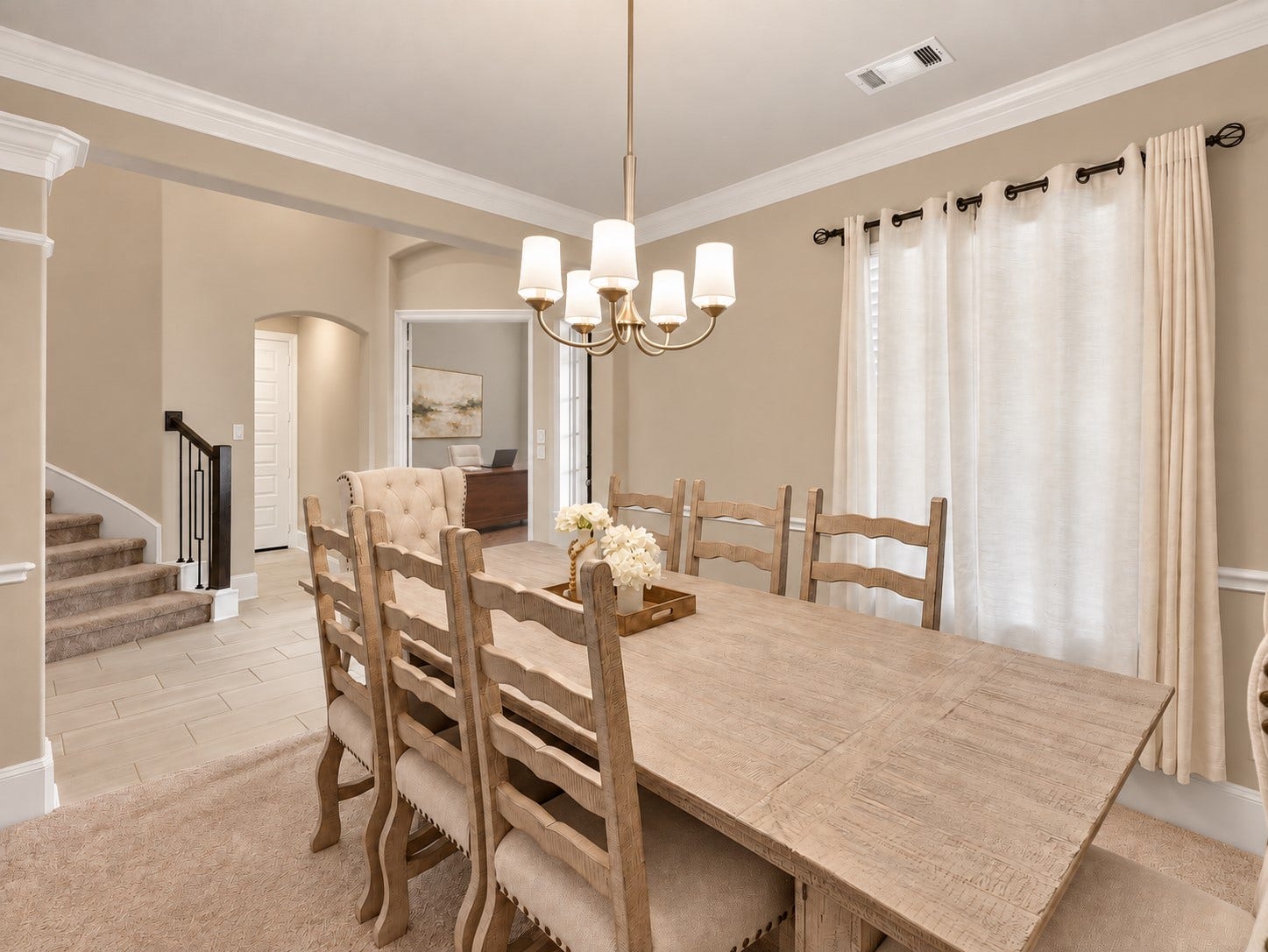 6714 Wellbrook Falls Lane, Katy, TX 77493 Alternate dining room view shows natural light and access to the foyer. (virtually staged)