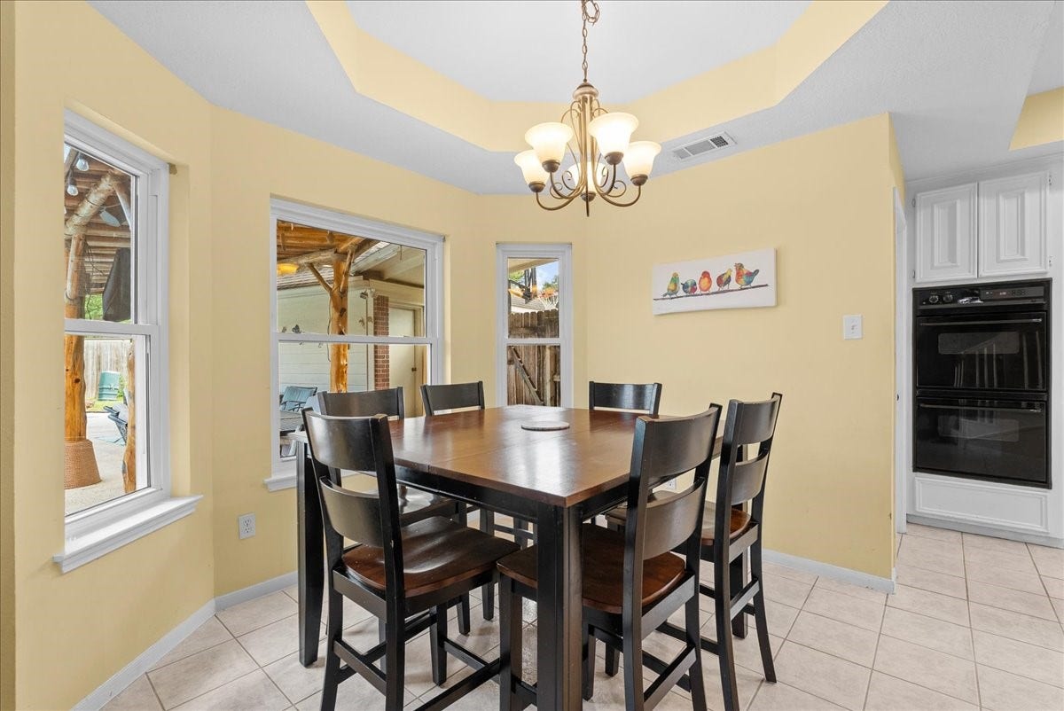 1908 Summer Reef Drive, League City, TX 77573 Notice the tray ceilings, and updated bay windows that complete the breakfast area.