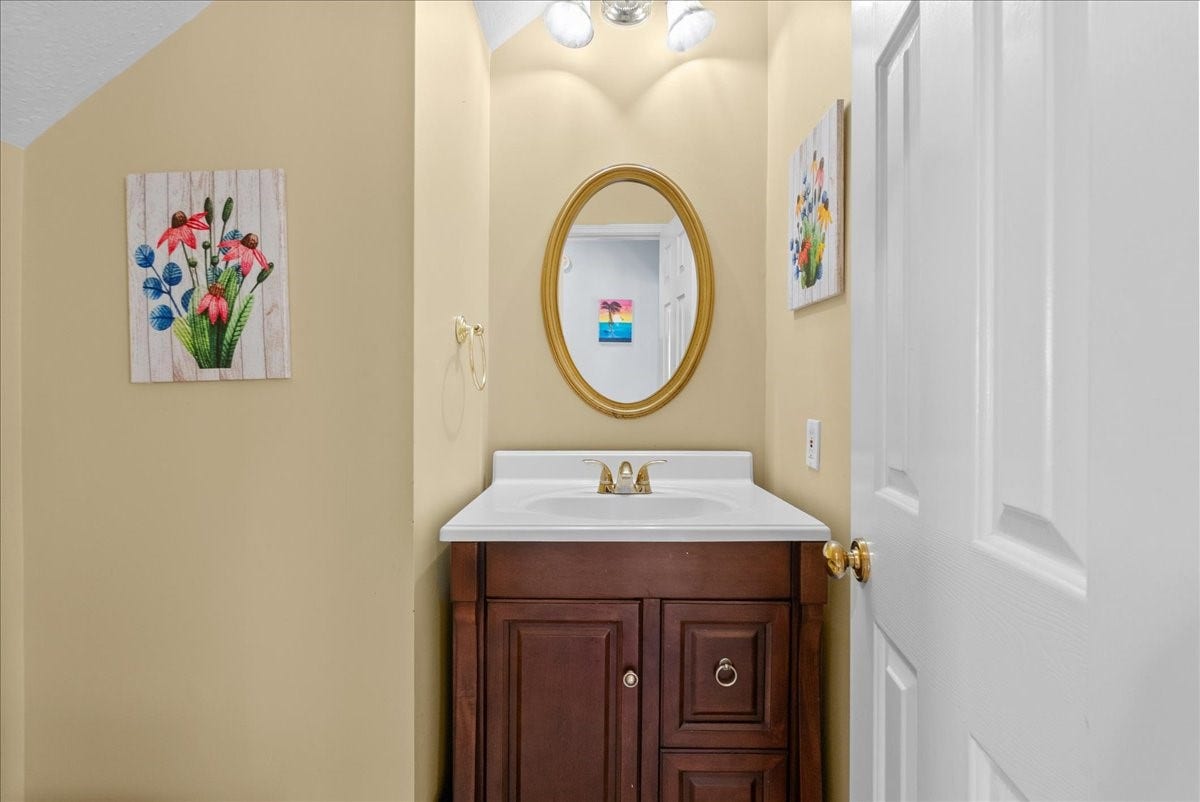1908 Summer Reef Drive, League City, TX 77573 Half bathroom downstairs with an updated vanity.