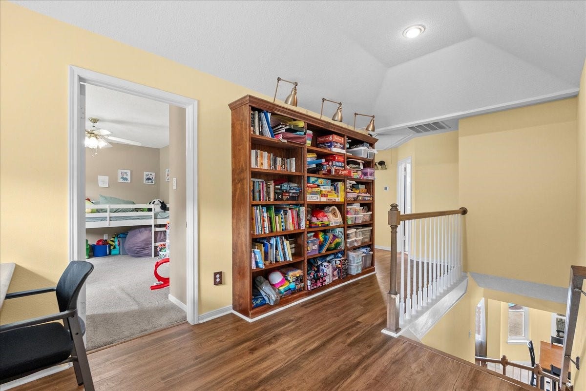 1908 Summer Reef Drive, League City, TX 77573 The landing offers a fantastic option for a secondary office or homework area with all wood built-ins.