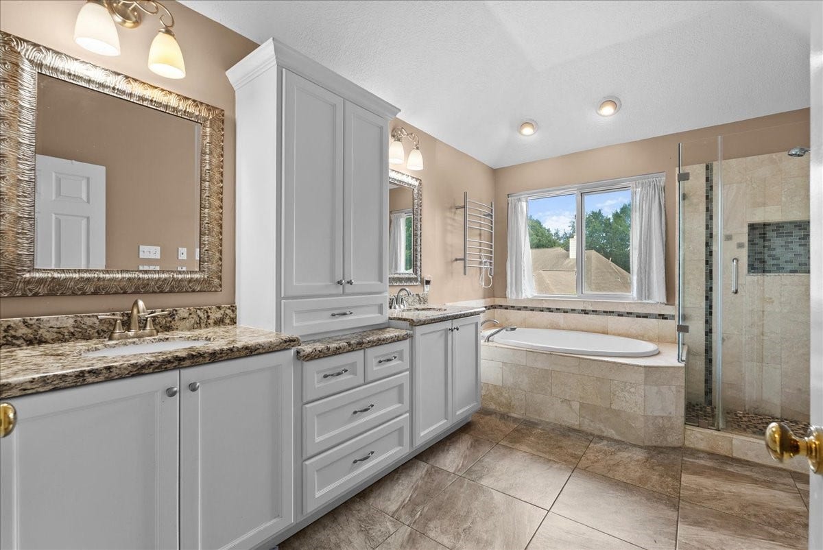 1908 Summer Reef Drive, League City, TX 77573 Check out the dual sinks, soaking tub, frameless and shower.
