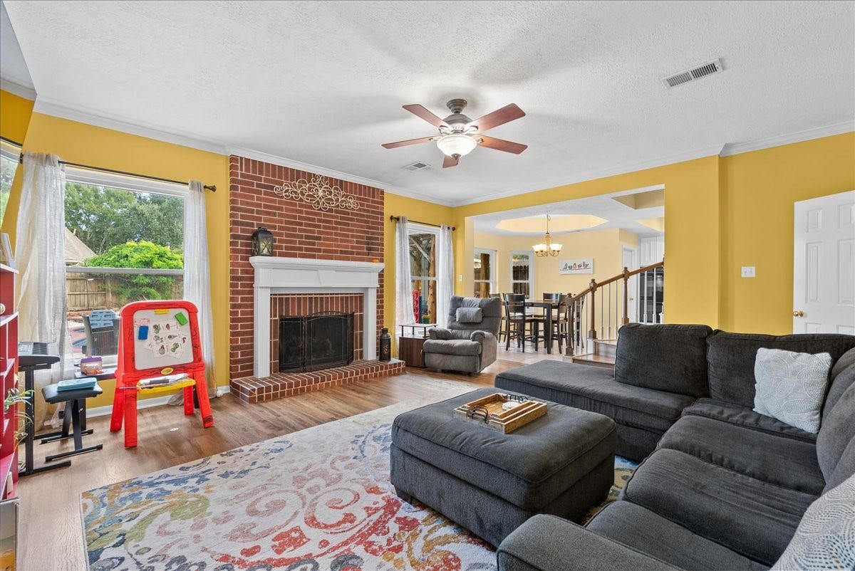 1908 Summer Reef Drive, League City, TX 77573 All brick fireplace completes the space, just in time for the holidays!