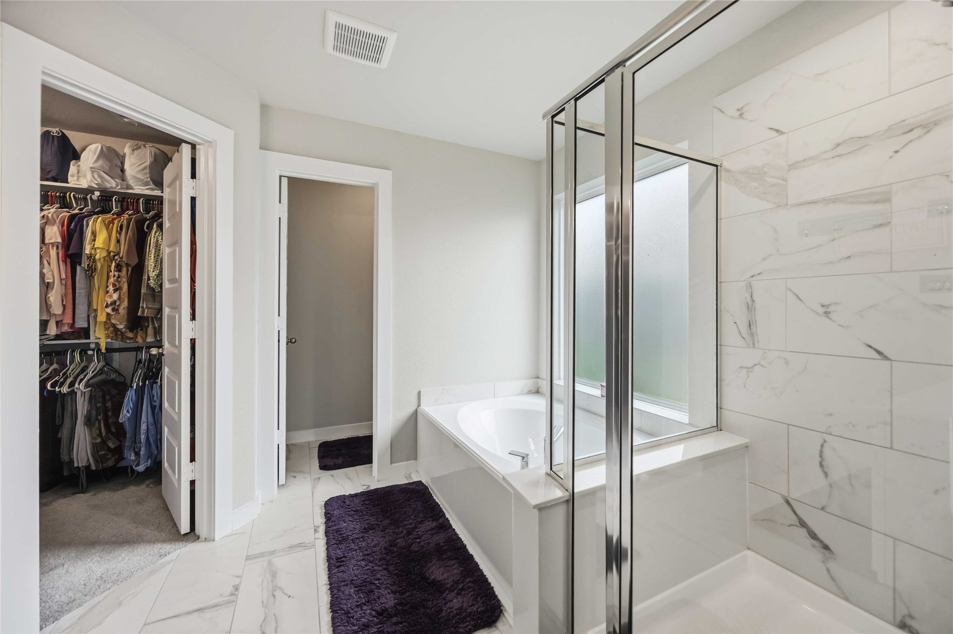 615 Orchard Vale Road, Rosharon, TX 77583 Step into the spacious primary bathroom, complete with a walk-in closet for added comfort and convenience.