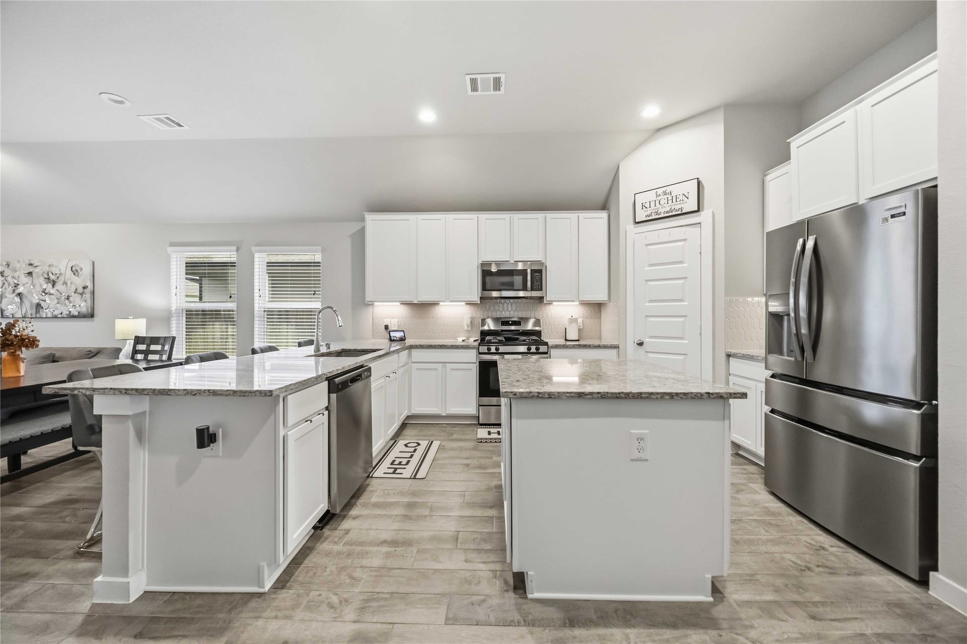 615 Orchard Vale Road, Rosharon, TX 77583 The choice of color for the cabinets, countertops and flooring open up the space and make decorating a breeze.