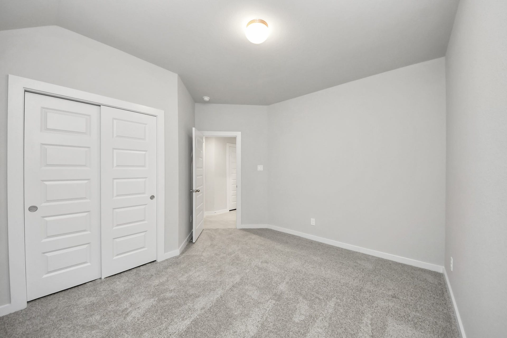 11023 Hosta Stream Drive, Houston, TX 77044 Generously sized secondary bedrooms featuring spacious closets, soft and inviting carpeting underfoot, large windows allowing plenty of natural light, and the added touch of privacy blinds for your personal retreat. Sample photo of completed home with similar floor plan. Actual colors and selections may vary.