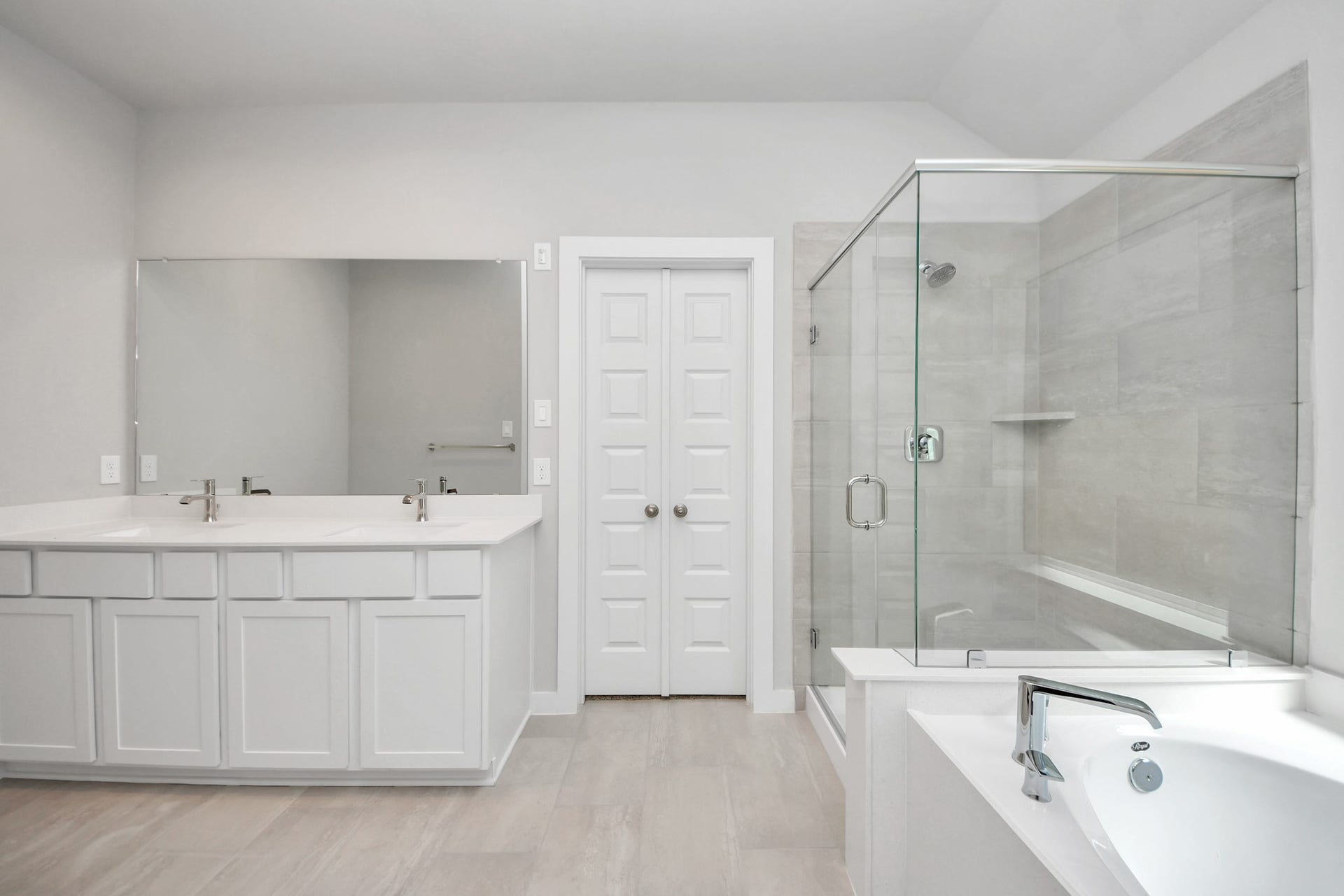 11023 Hosta Stream Drive, Houston, TX 77044 Elevate your daily routine at the elegant vanity, now equipped with double sinks, light countertops, modern hardware, and beautiful recessed lights. Sample photo of completed home with similar floor plan. Actual colors and selections may vary.