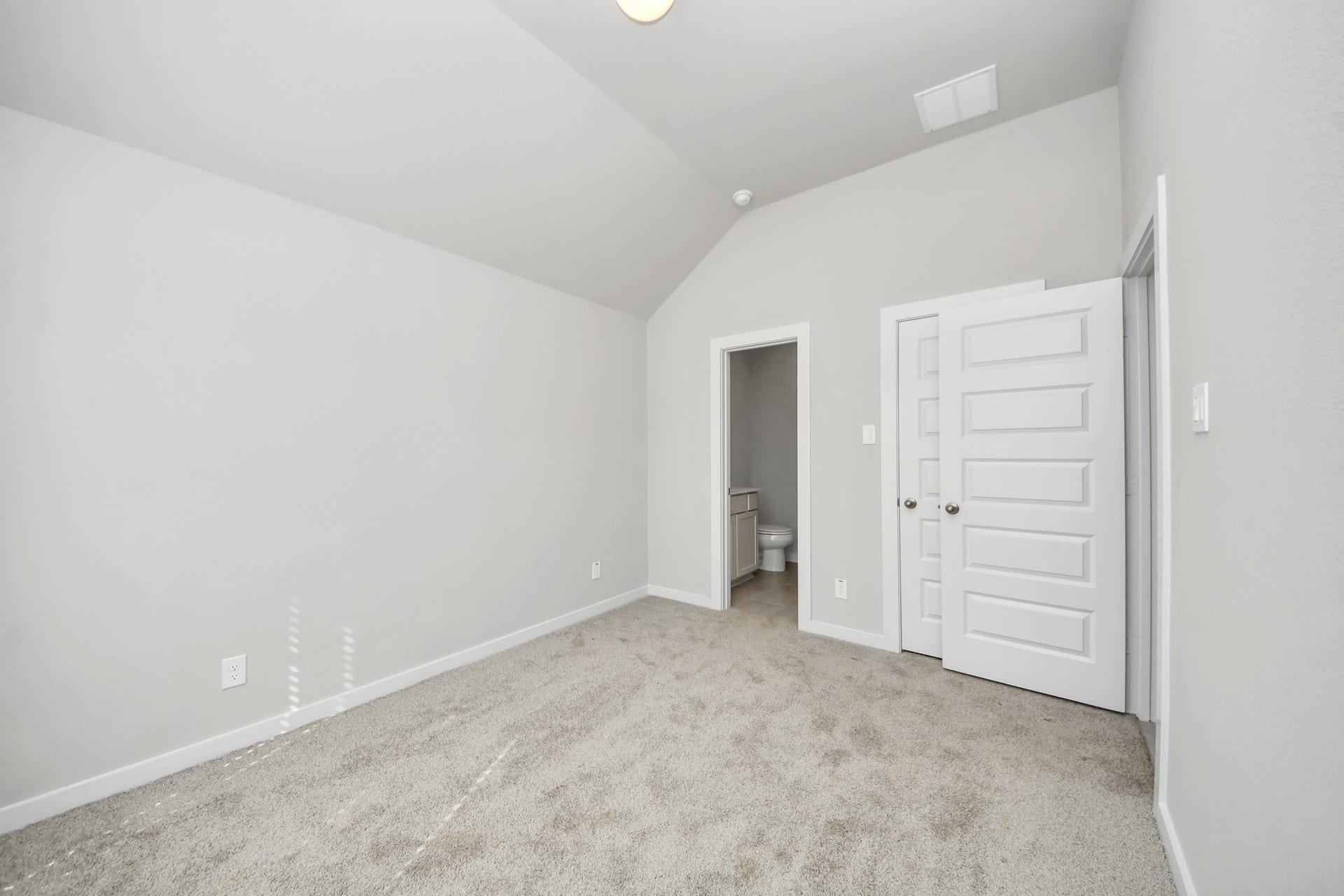 11023 Hosta Stream Drive, Houston, TX 77044 Generously sized secondary bedrooms featuring spacious closets, soft and inviting carpeting underfoot, large windows allowing plenty of natural light, and the added touch of privacy blinds for your personal retreat. Sample photo of completed home with similar floor plan. Actual colors and selections may vary.