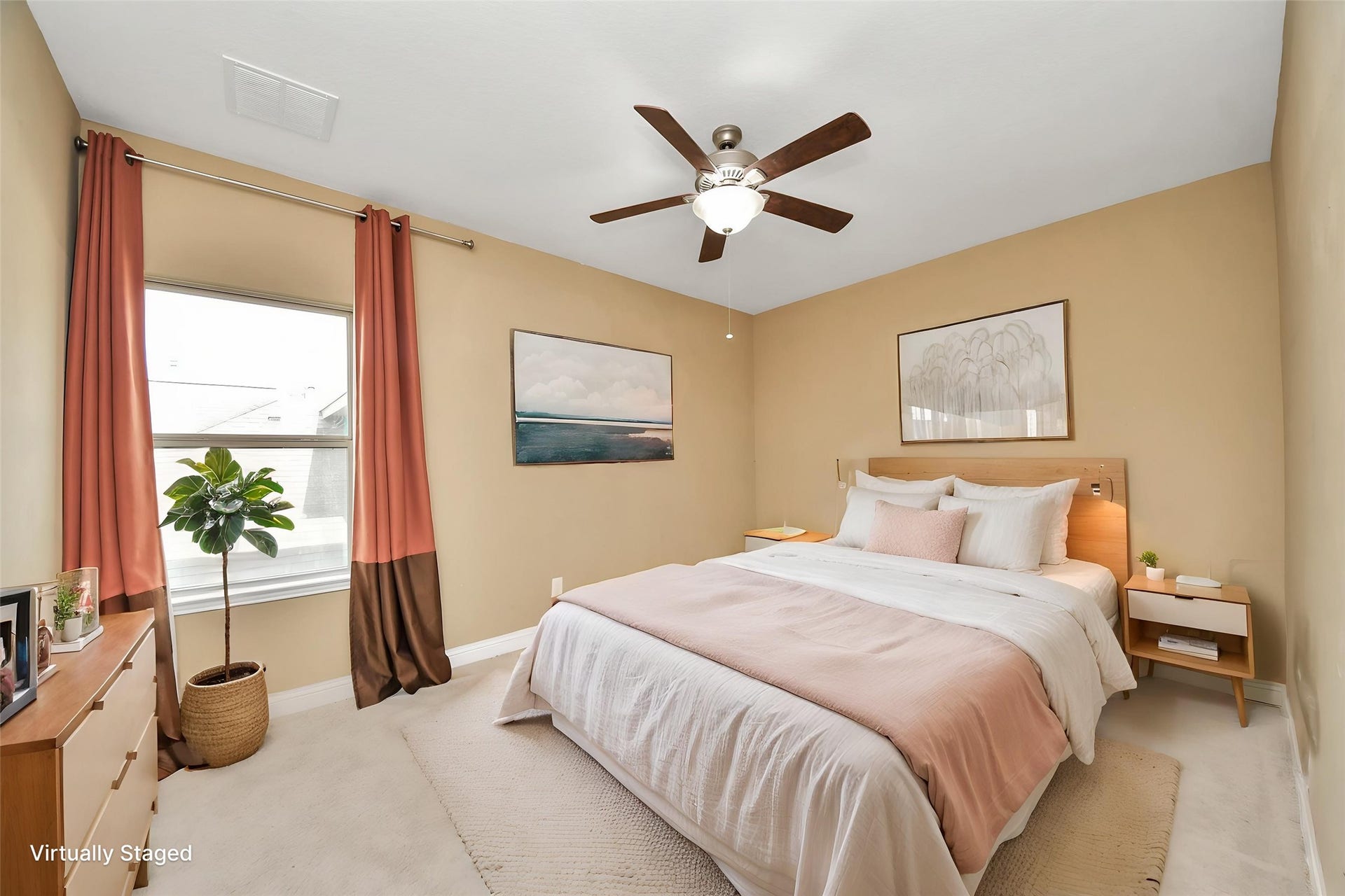 Virtually Staged  Spacious bedroom with a ceiling fan, generous natural light, and ample room for comfortable furnishings.