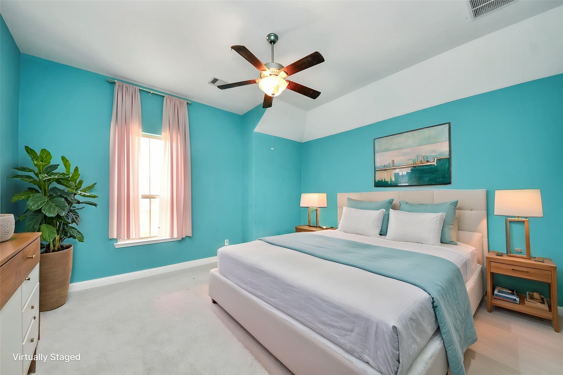 Virtually Staged  Bright, generously sized bedroom featuring a high ceiling, ceiling fan, and plenty of space for a complete bedroom suite