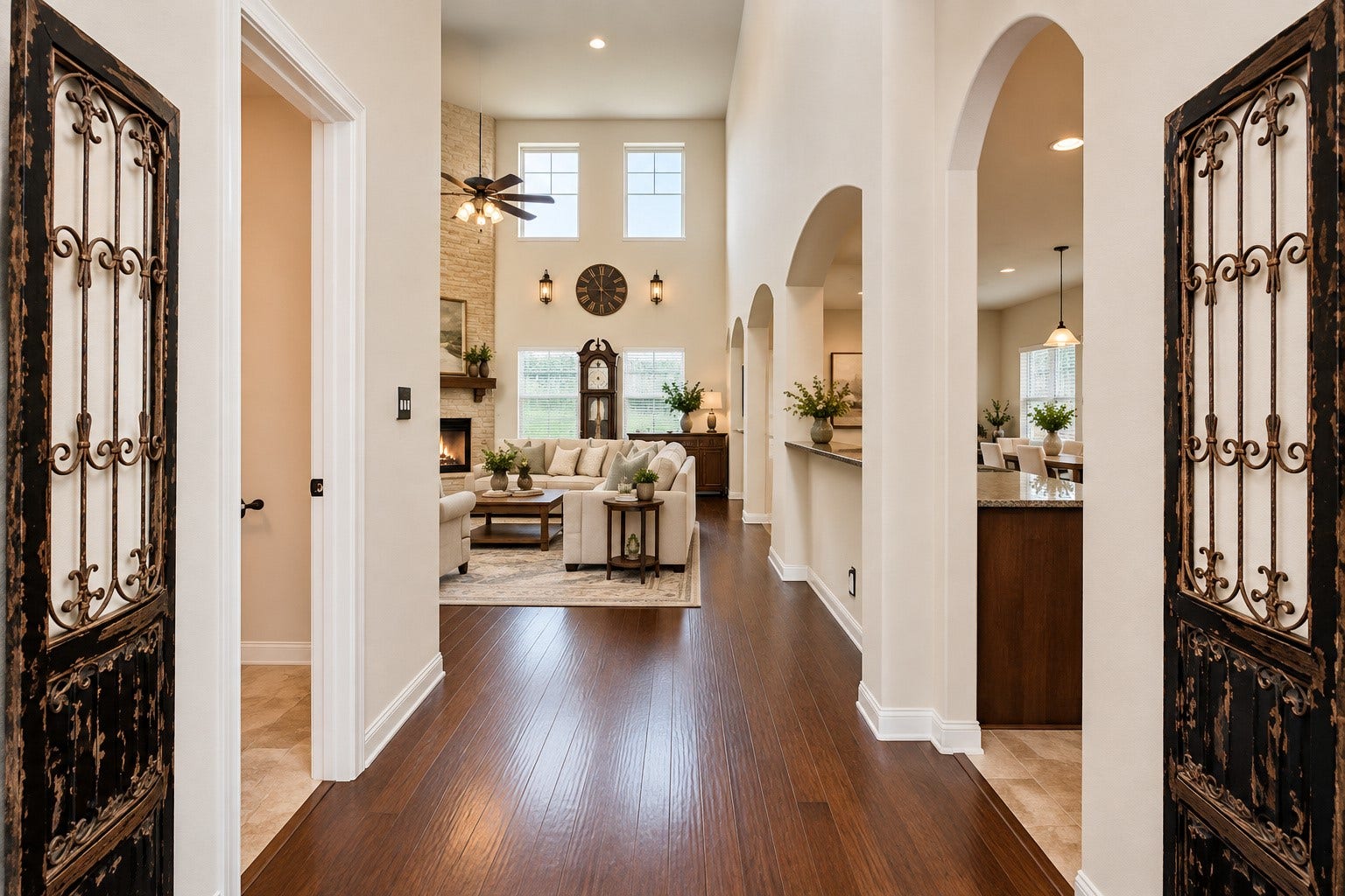 Front Entry featuring wood flooring, high ceilings, beautiful arched doorways & crown molding.  *Virtually Staged