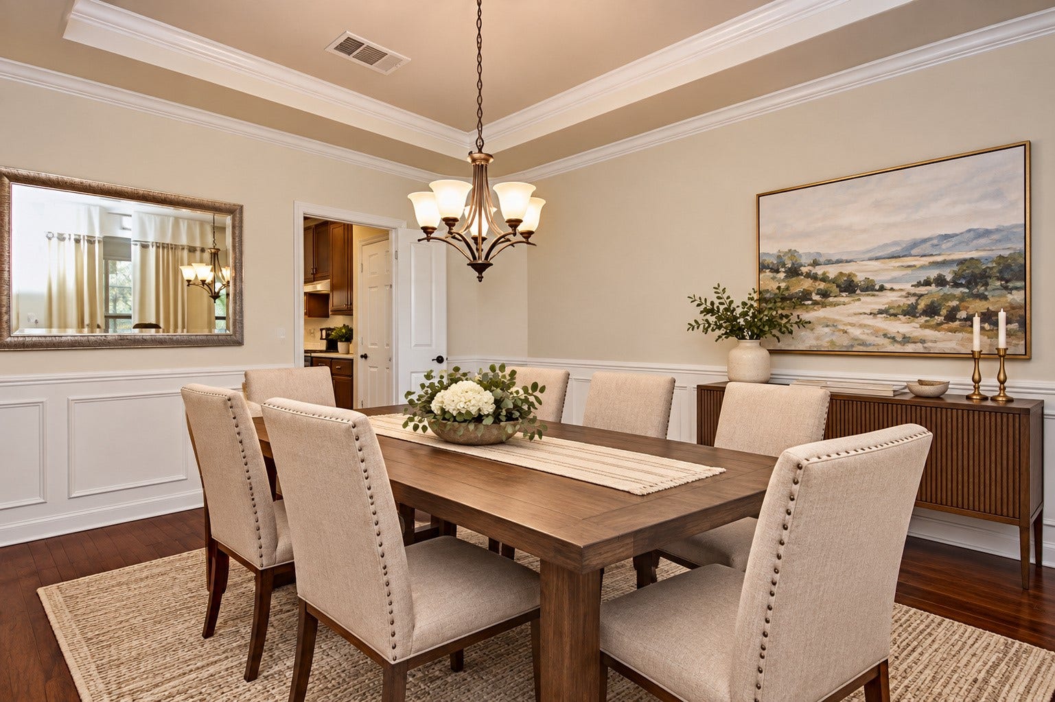 Formal Dining Room is large with a beautiful tray ceiling, crown molding and pendant light fixture *Virtually Staged