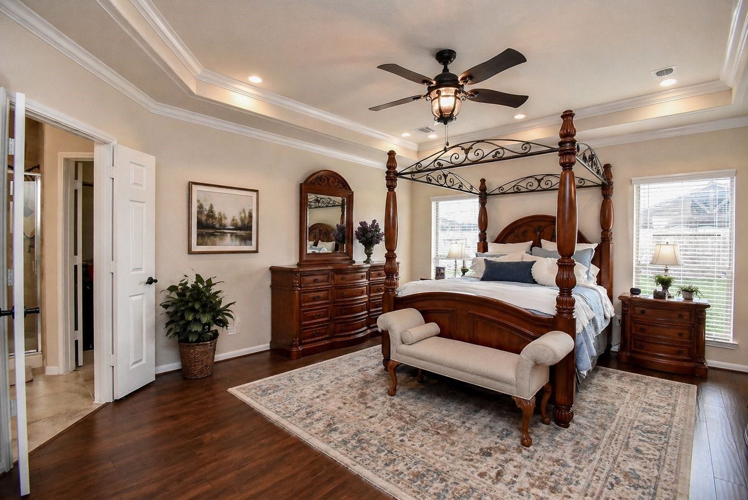 Primary Bedroom is HUGE with tray ceiling, crown molding and wood flooring.  *Virtually Staged