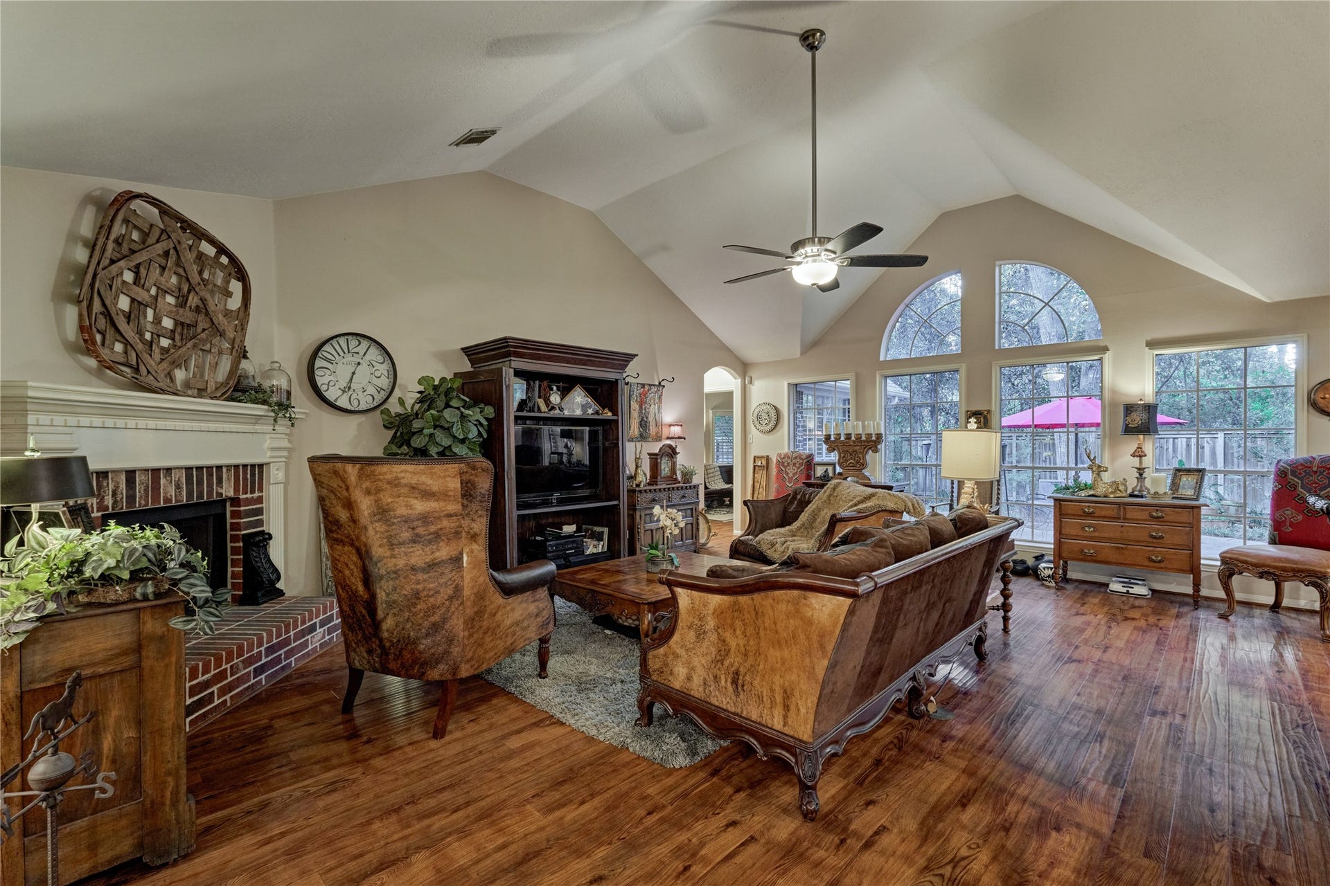 119 N Rambling Ridge Place, The Woodlands, TX 77385 the space with natural light and bringing the beauty of the wooded backyard indoors.
