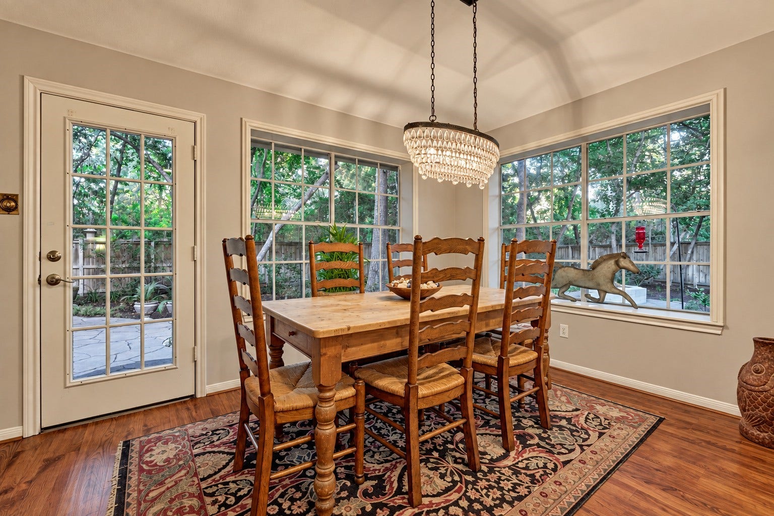 119 N Rambling Ridge Place, The Woodlands, TX 77385 Sunlight pours through the windows, creating a bright, inviting breakfast room - the perfect spot to sip your morning coffee and start the day while enjoying beautiful backyard views.