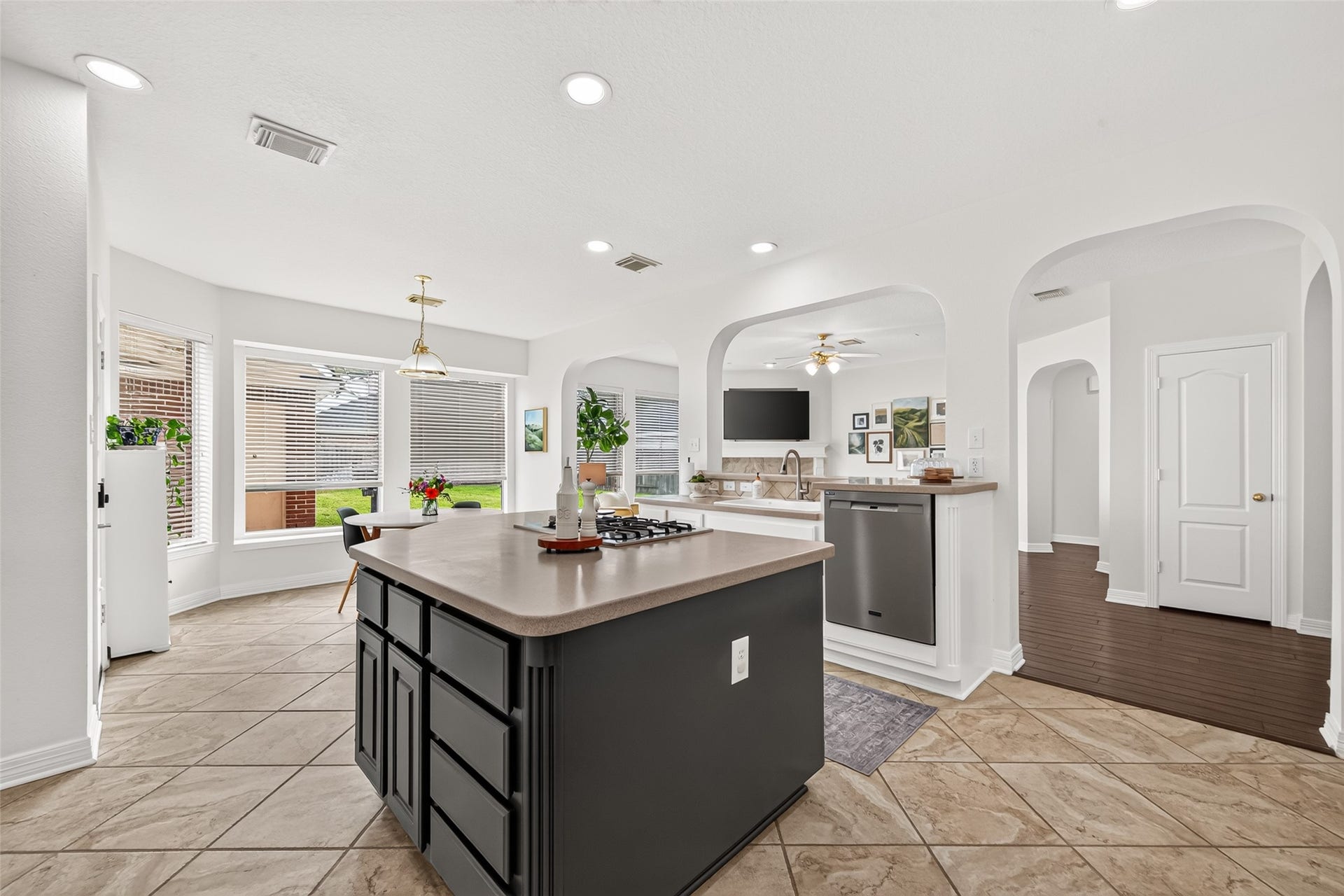 Bright and inviting kitchen with a gourmet island, stainless steel appliances.