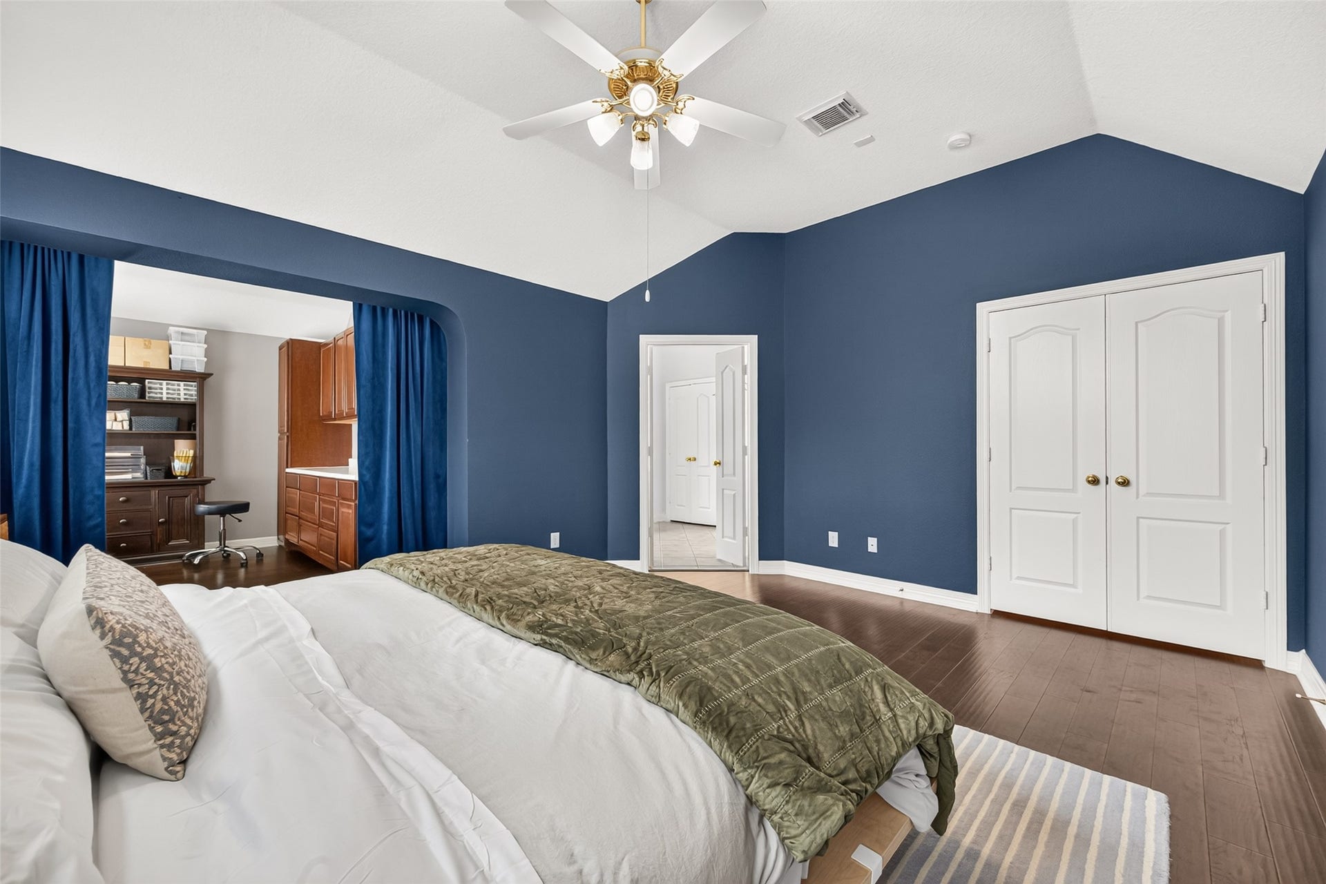 Spacious primary bedroom Features a cozy reading nook or office space.