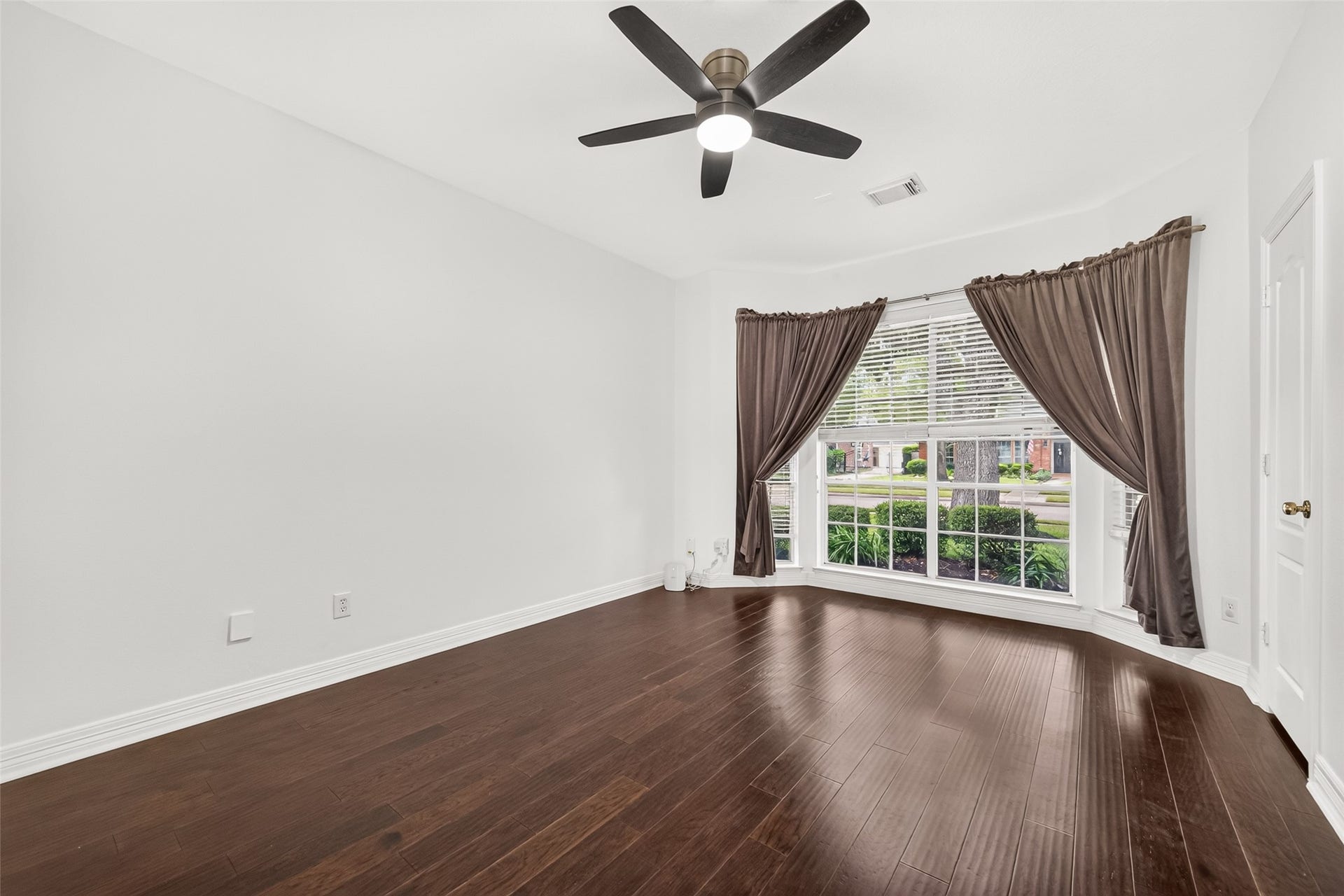 First floor guest bedroom with abundant natural light.