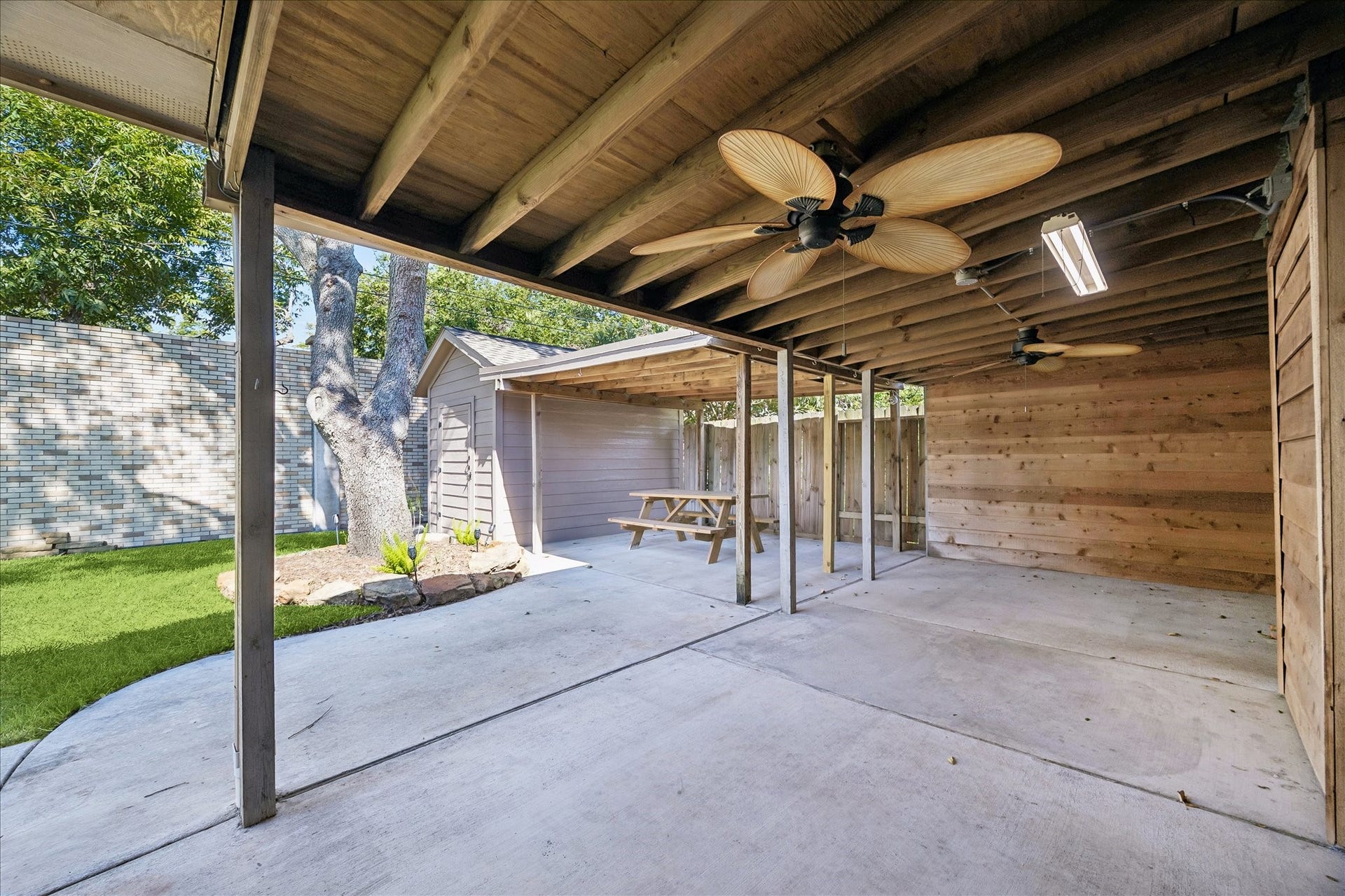 3911 Kitchen Hill Lane, Sugar Land, TX 77479 Rain or shine, enjoy a shaded outdoor retreat with room for seating, casual meals, and relaxing afternoons