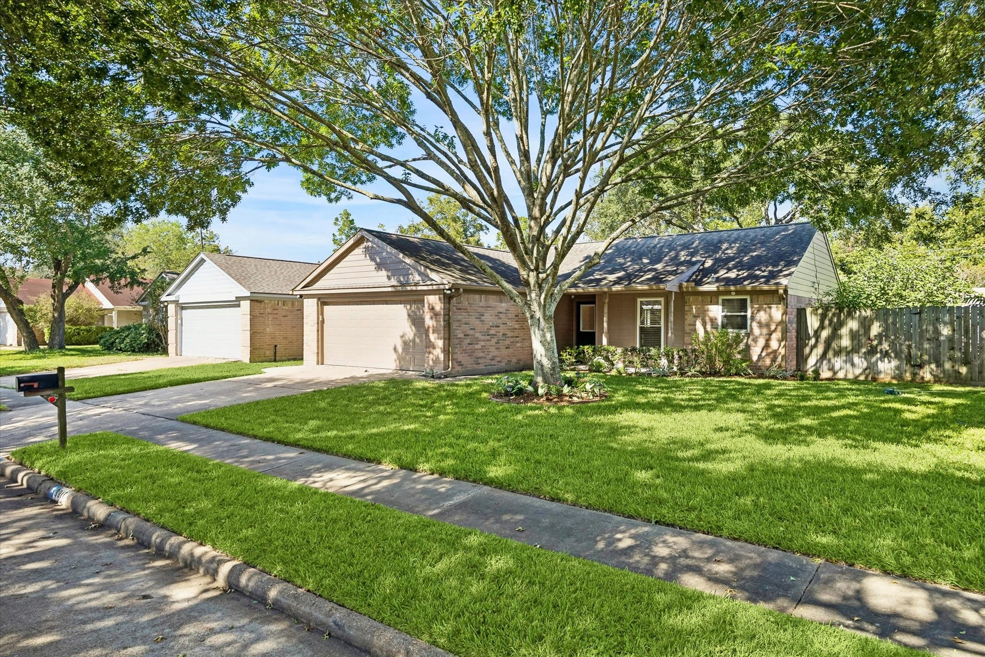 3911 Kitchen Hill Lane, Sugar Land, TX 77479 Enjoy the charm of an established neighborhood with mature trees, a green lawn, and a home that feels inviting from the street