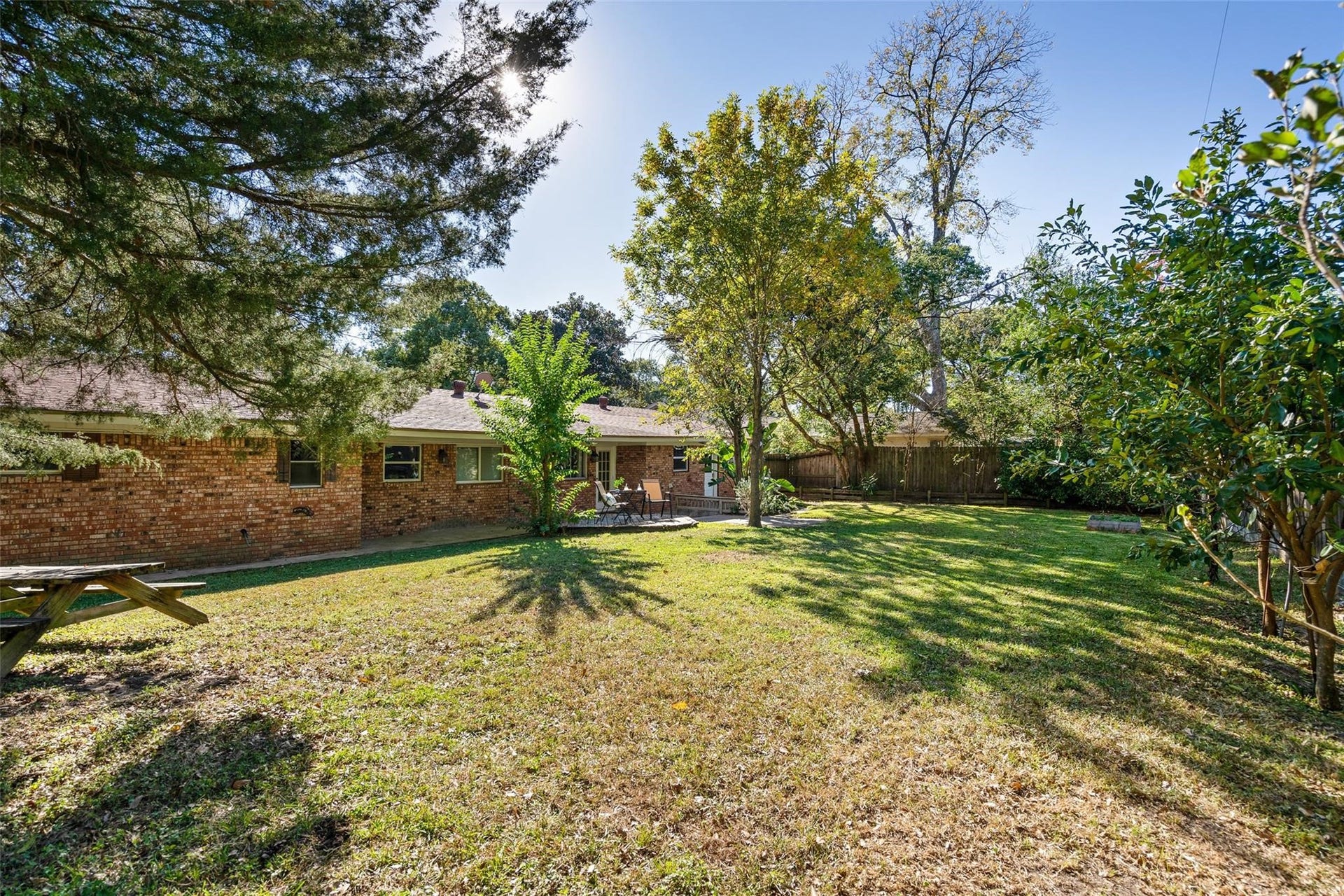 This immense yard is a rare find so close to central Houston! Lush landscaping with multiple fruit trees line the perimeter.*Home was previously furnished. There is currently no furniture in the home.