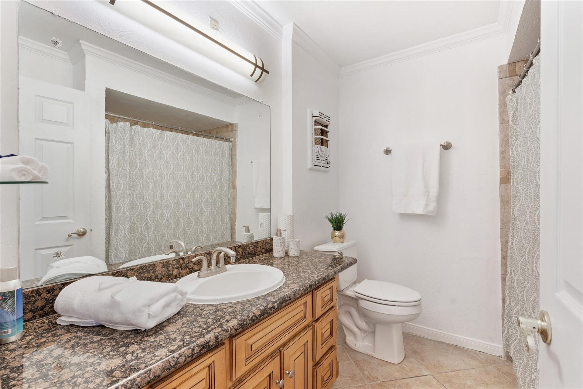 The secondary bathroom has an abundance of counter space and storage!*Home was previously furnished. There is currently no furniture in the home.