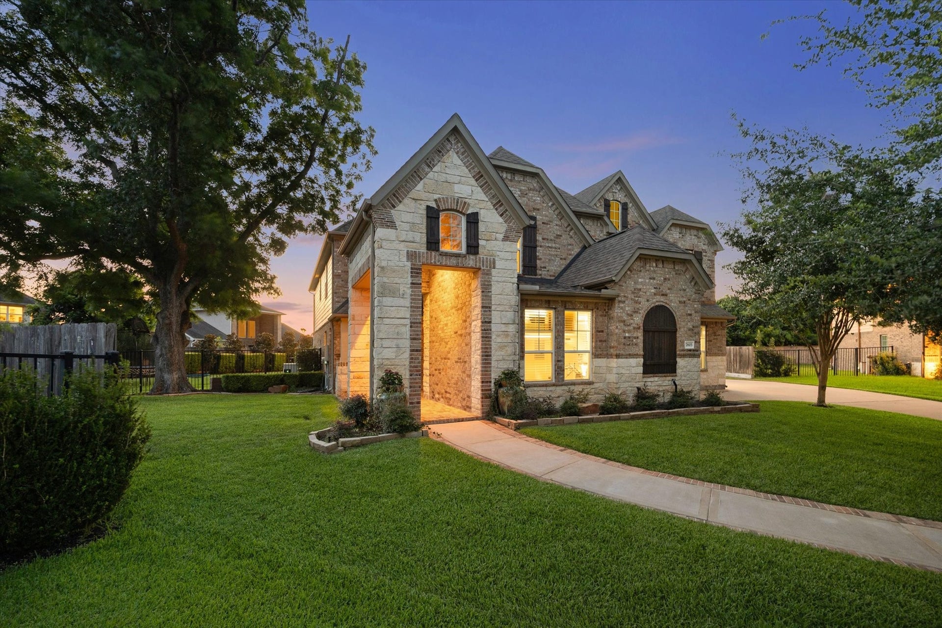 This Beautiful home in a gated section of Sienna, is tucked on a quiet cul-de-sac lot backing to a peaceful greenbelt, with 6 bedrooms, 4.5 baths, 4,414 square feet, a split 3-car garage, and an incredible backyard retreat with a heated pool and spa.