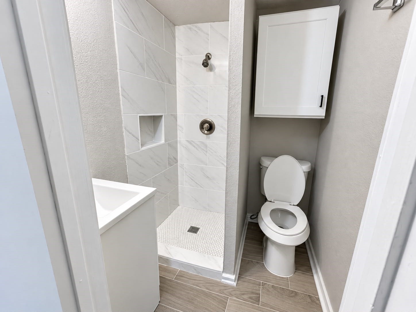 9711 Linkmeadow Lane, #12B, Houston, TX 77025 Bathroom with tiled walk-in shower.