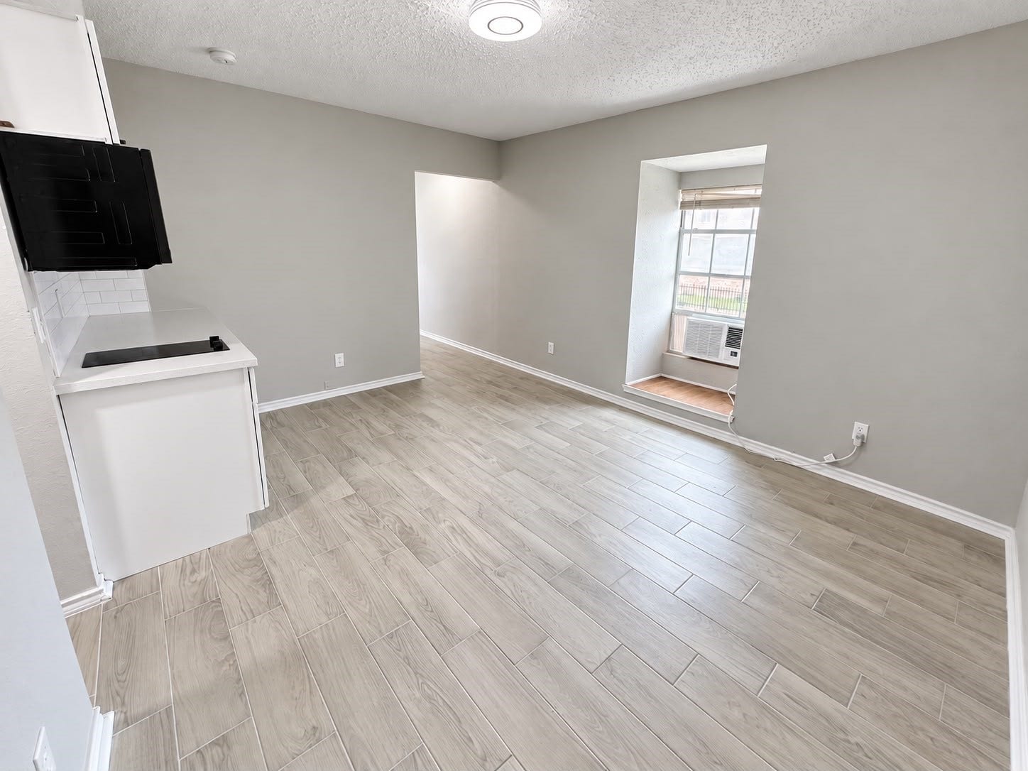 9711 Linkmeadow Lane, #12B, Houston, TX 77025 Bright studio interior with window and natural light.