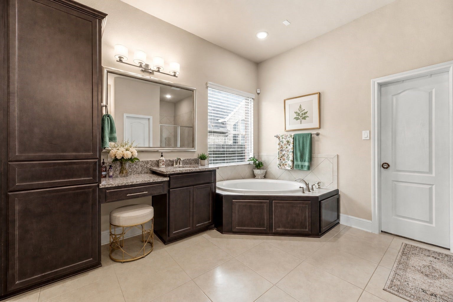 22826 Burton Grove Road, Richmond, TX 77469 The well appointed primary bath features 2 sinks, one with a vanity area, a soaking tub, and a generously sized shower. (virtually staged)